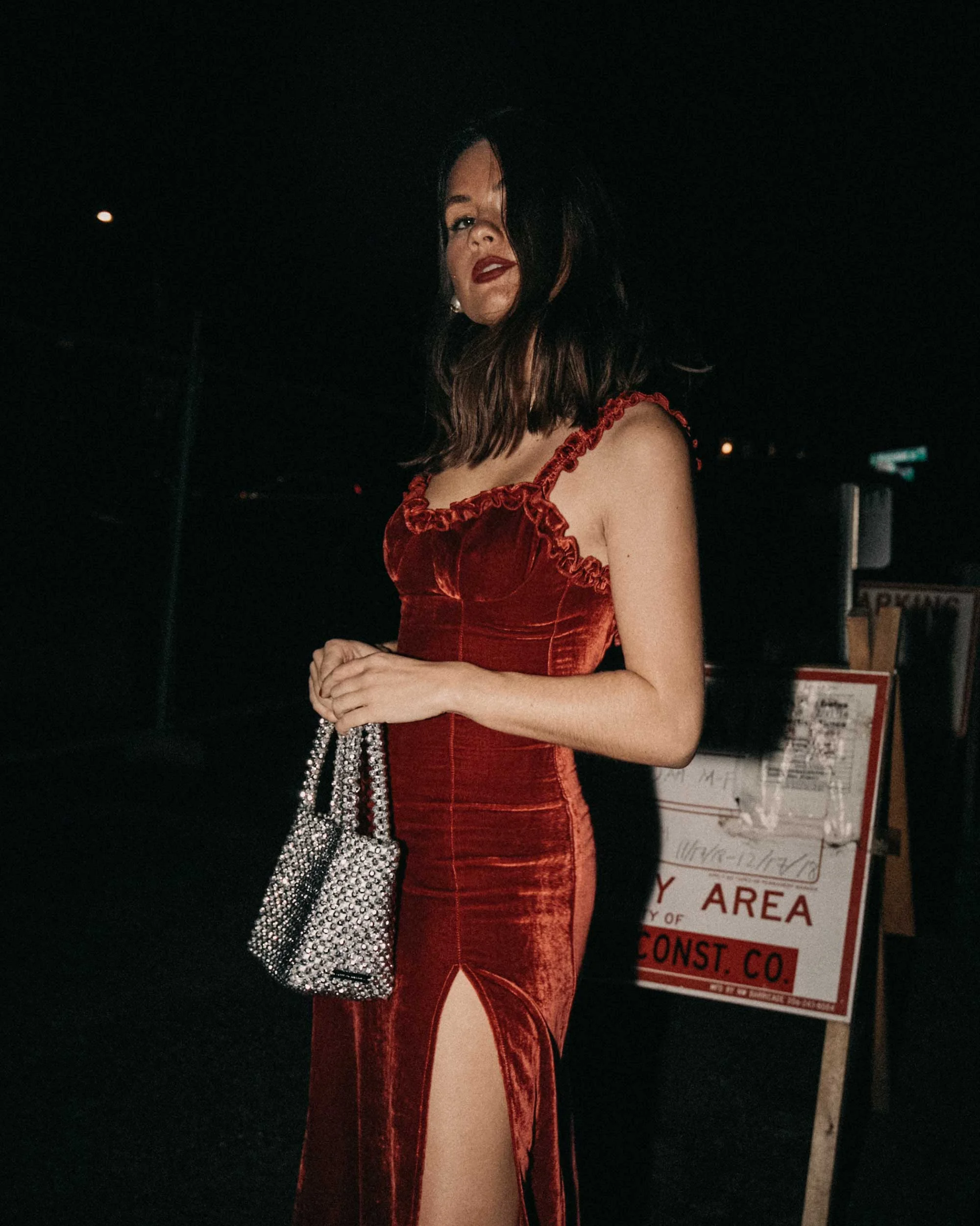 Reformation Pyrenees red velvet midi length dress with a ruffle neckline, and a side slit holiday outfit2.jpg