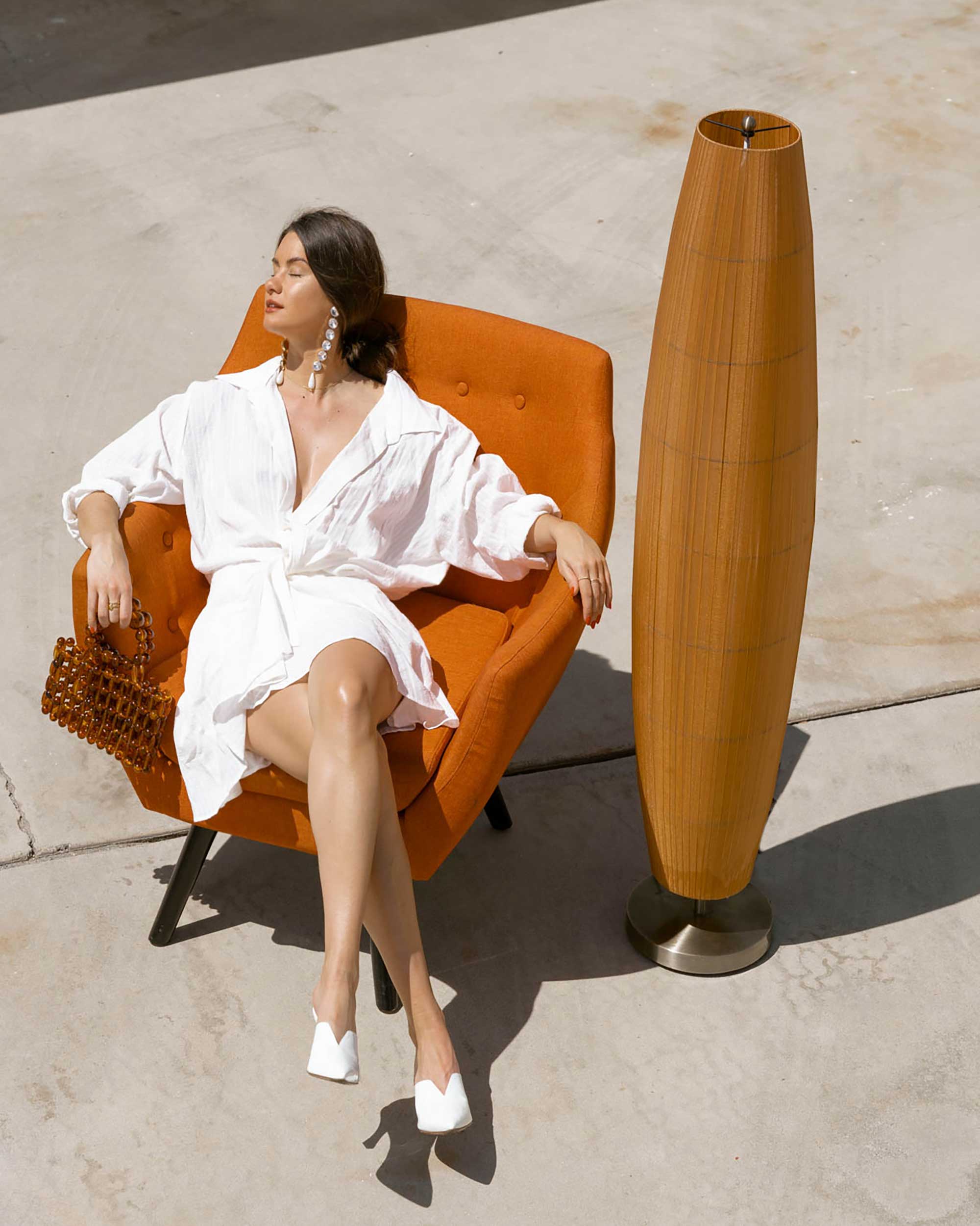 Sarah Butler of Sarah Styles Seattle wears Jacquemus Alassio draped white cotton mini dress and Cult Gaia Acrylic Cora Clutch in tortoise shell brown Palm Springs Outfit | @sarahchristine 10.jpg