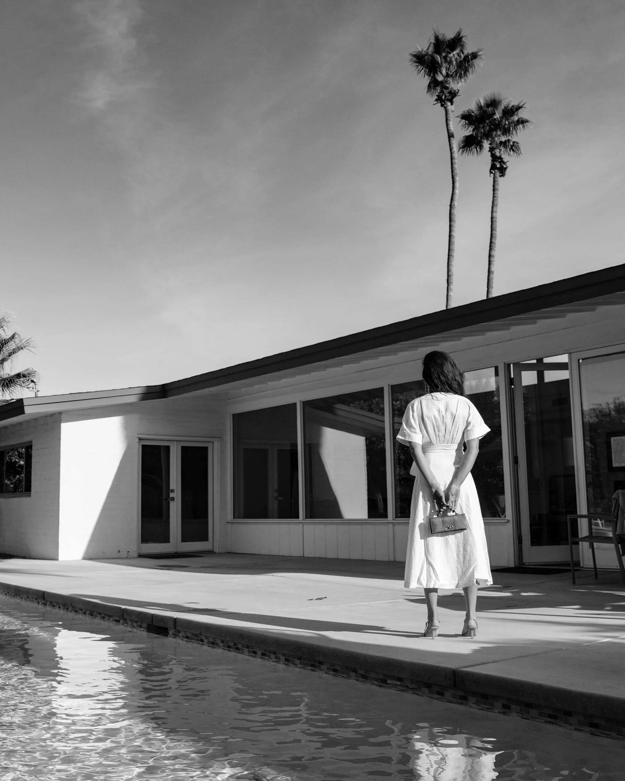 Sarah Butler of Sarah Styles Seattle wears Nauman Linen Dress in Bright White and Ferragamo Mini Gancini Top Handle Wallet in Palm Springs Outfit | @sarahchristine.jpg