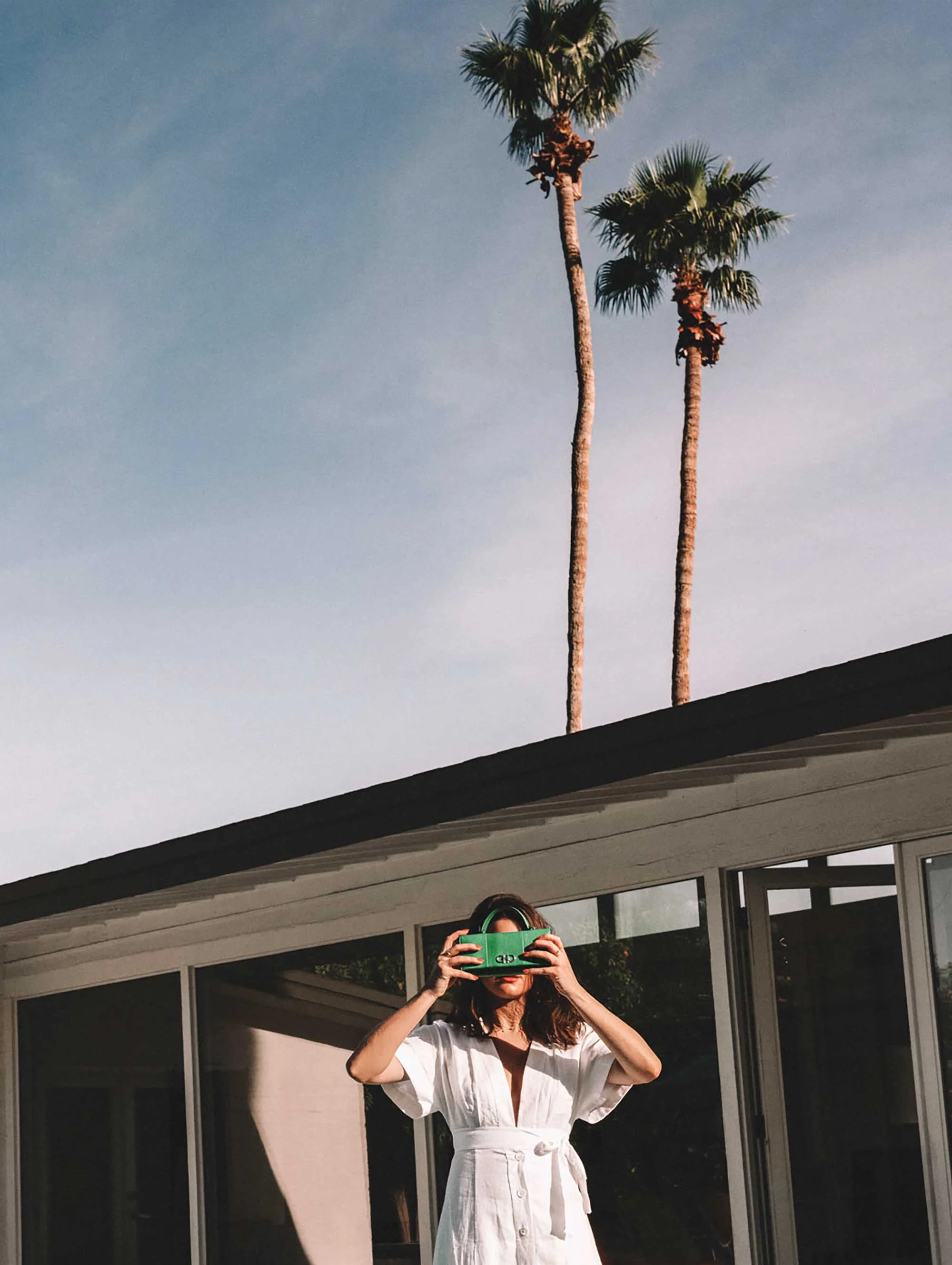 Sarah Butler of Sarah Styles Seattle wears Nauman Linen Dress in Bright White and Ferragamo Mini Gancini Top Handle Wallet in Palm Springs Outfit | @sarahchristine.jpg