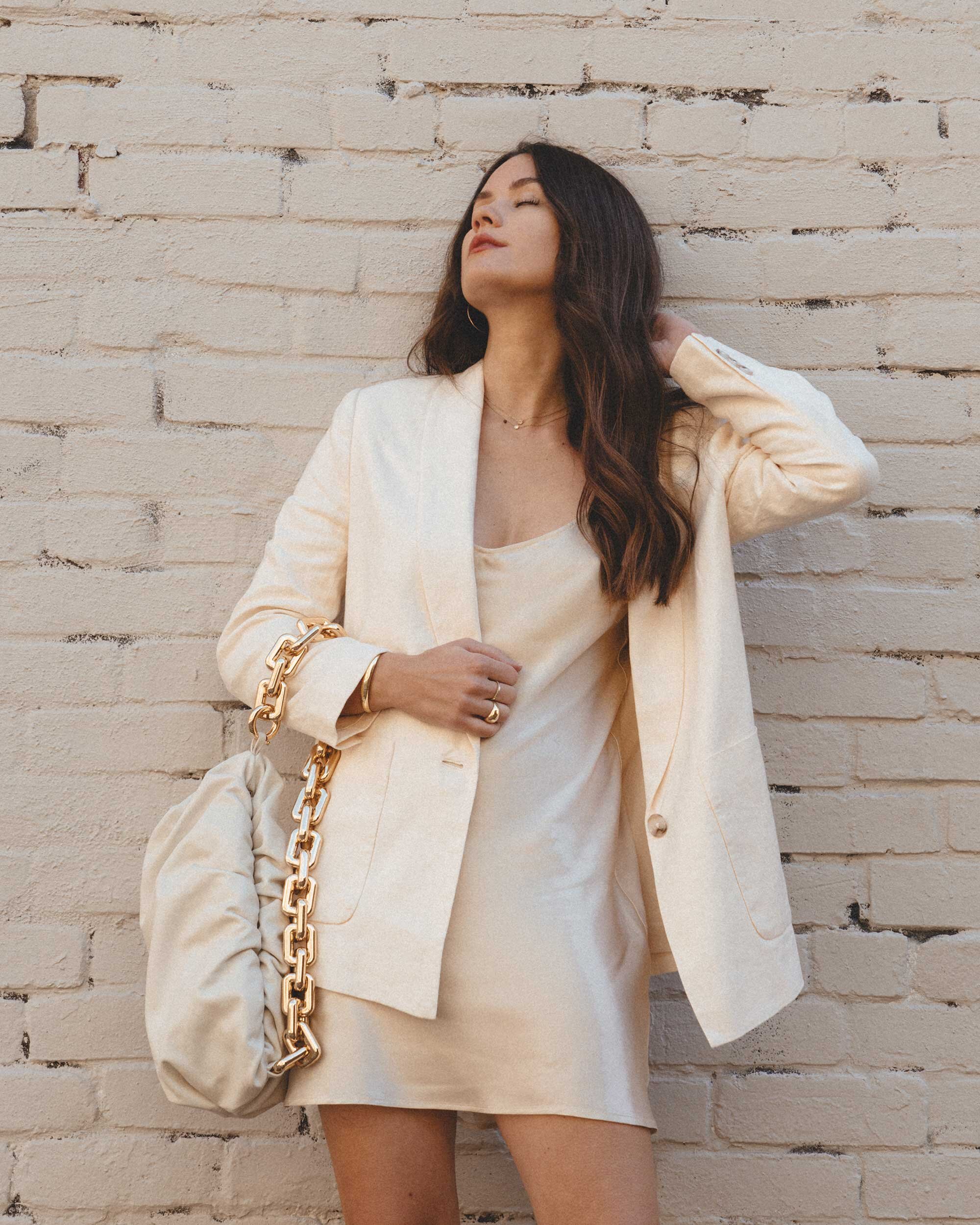 Early Fall Outfit Idea sophisticated linen blazer with elegant clean lines. Sarah Butler of @sarahchristine wearing Joie Dru Ecru Linen Blazer with beige satin mini slip dress and Bottega Veneta The Chain pouch shoulder bag -5.jpg