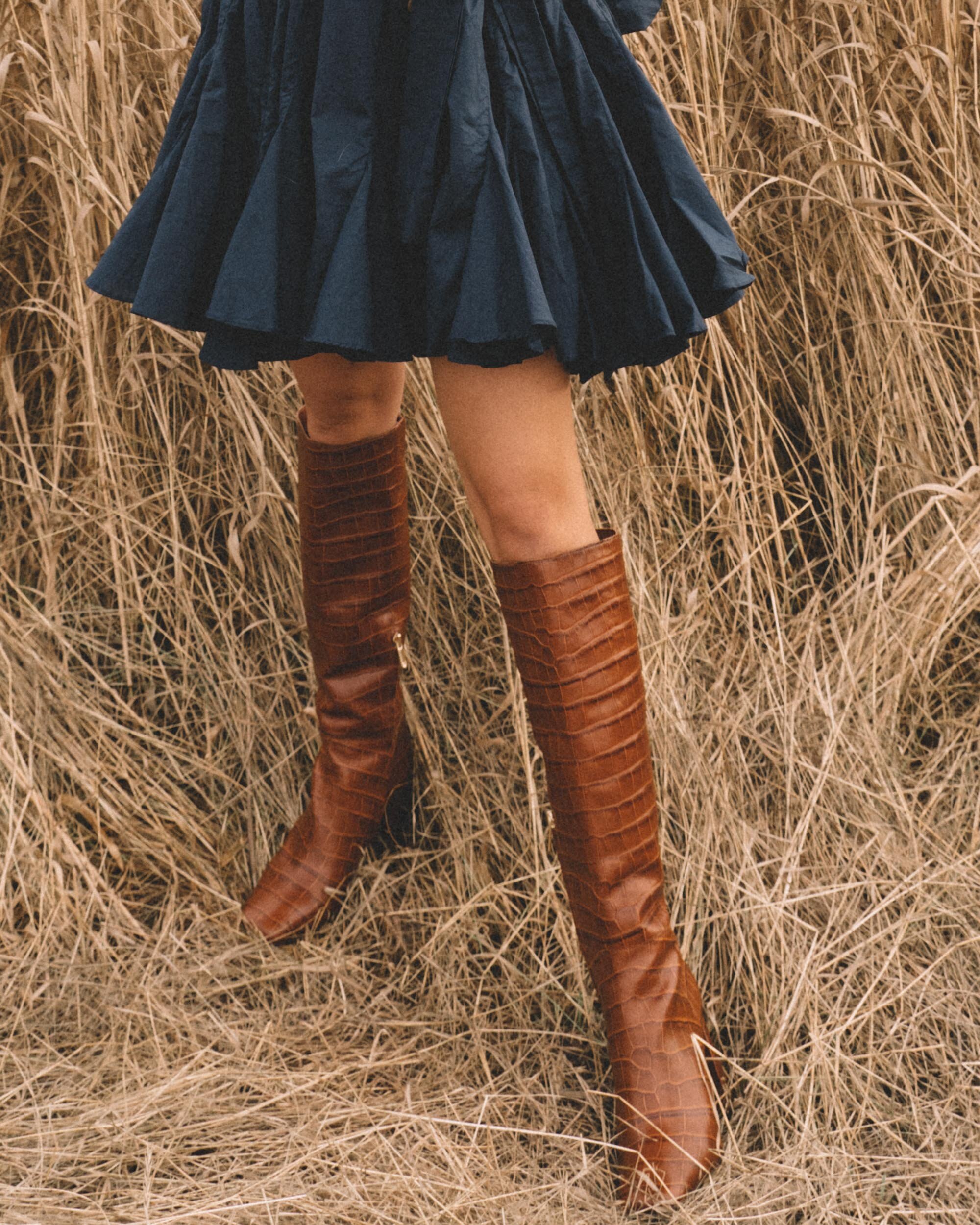 Chic Fall Dress Outfit. Sarah Butler of @sarahchristine wearing Rhode Emma Tie-Waist Flared Navy Dress and Brown Croc Knee High Boot in Seattle, Washington - -1.jpg