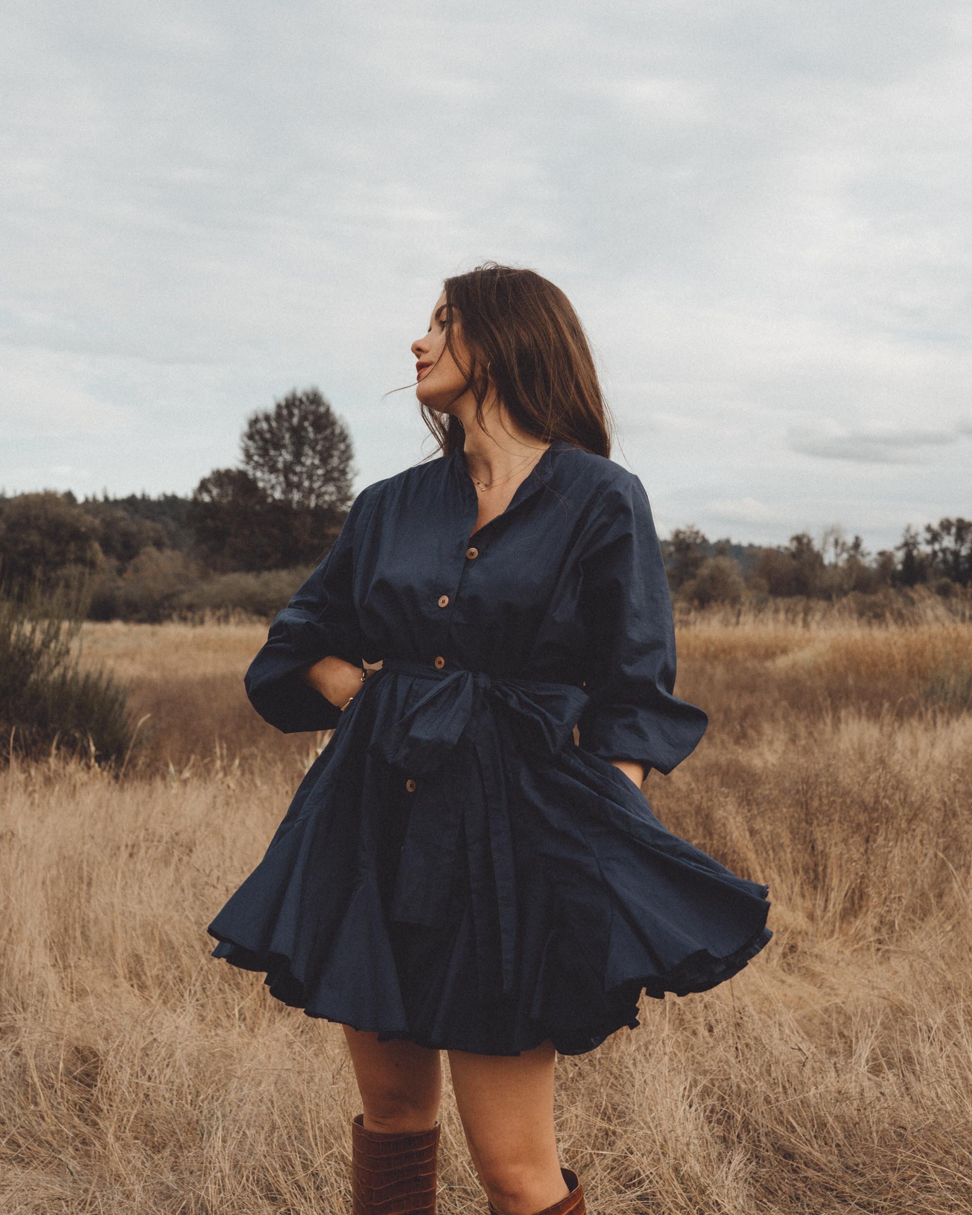 Chic Fall Dress Outfit. Sarah Butler of @sarahchristine wearing Rhode Emma Tie-Waist Flared Navy Dress and Brown Croc Knee High Boot in Seattle, Washington --9.jpg