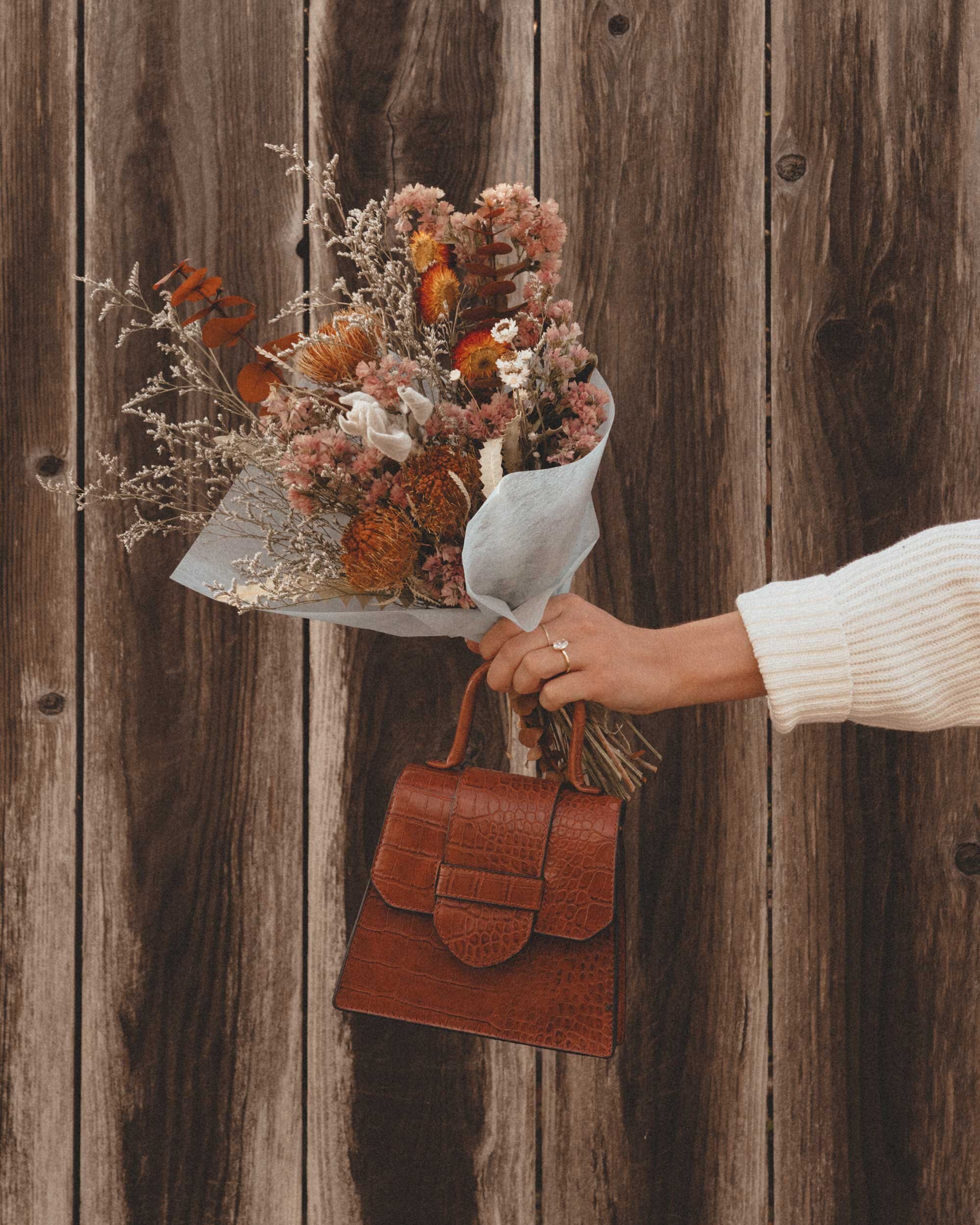 the wardrobe items that never get out of fashion: denim skirt, striped  sweater, western boots and a classical Celine box bag. All items…