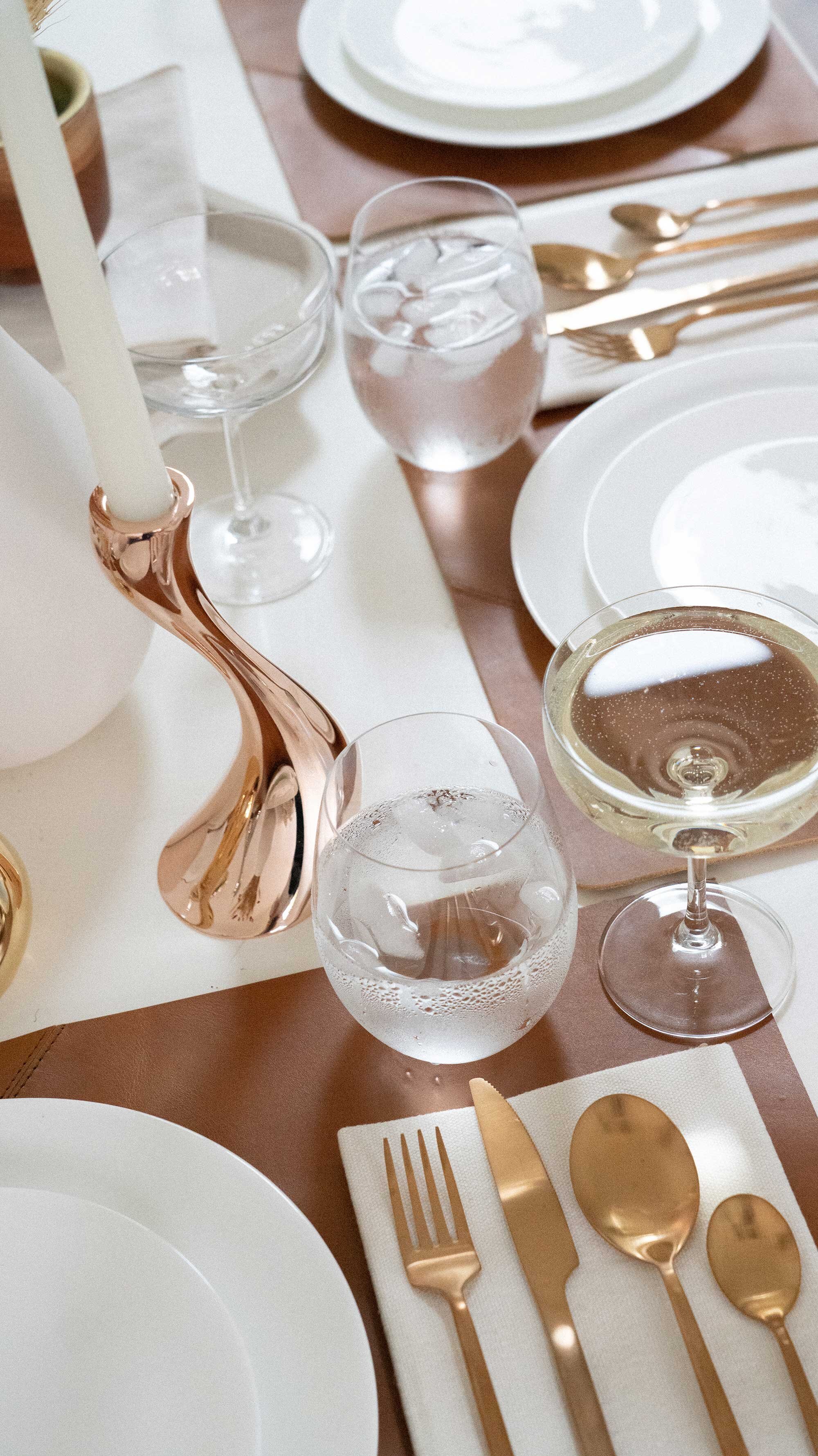 Thanksgiving table settings elegant gold. Sarah Butler of @sarahchristine Thanksgiving table settings featuring Georg Jensen Cobra Candleholder Set, tan leather placemats, and modern gold plated flatware with rustic dried flowers 33.jpg