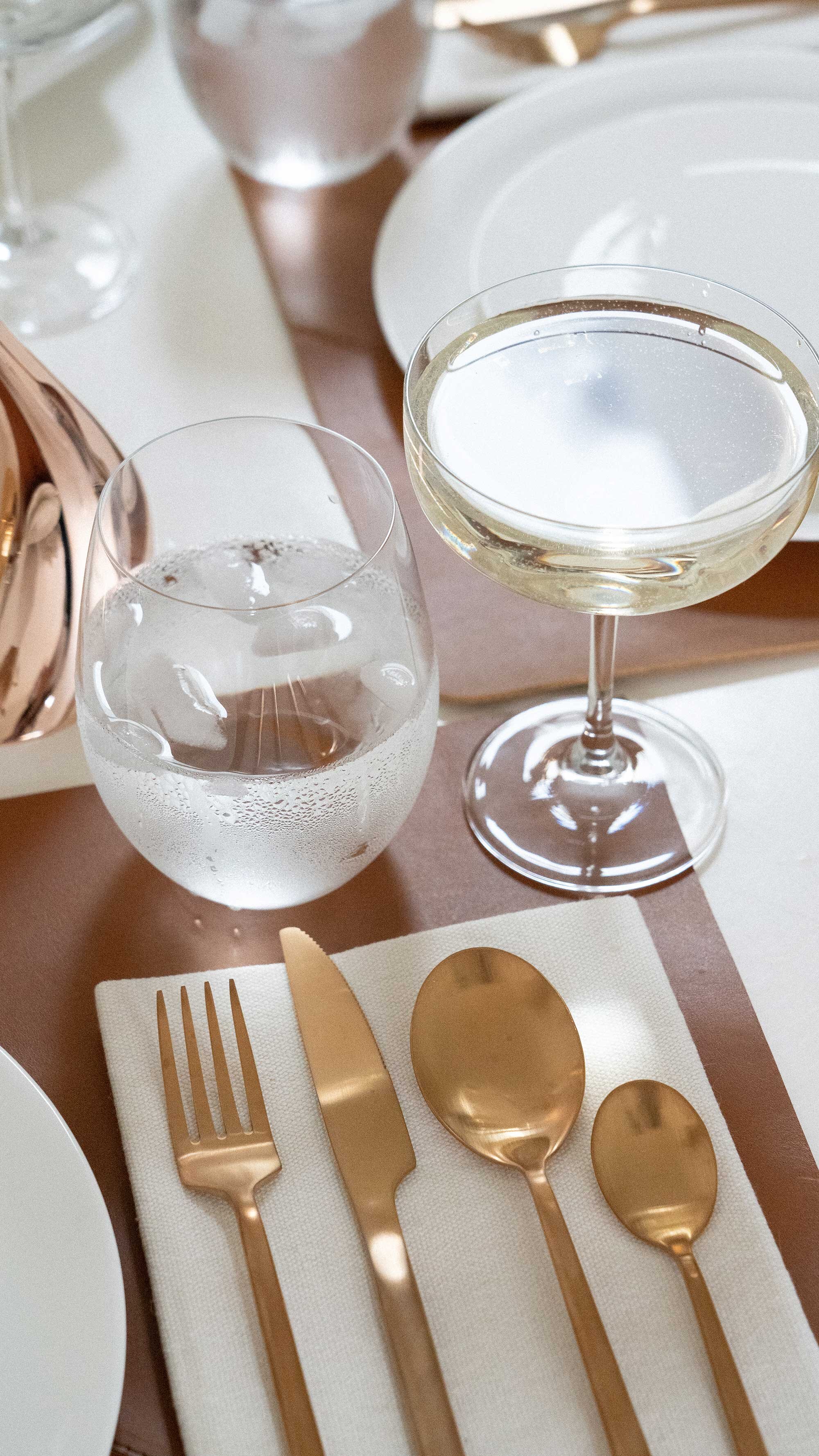 Thanksgiving table settings elegant gold. Sarah Butler of @sarahchristine Thanksgiving table settings featuring Georg Jensen Cobra Candleholder Set, tan leather placemats, and modern gold plated flatware with rustic dried flowers 32.jpg