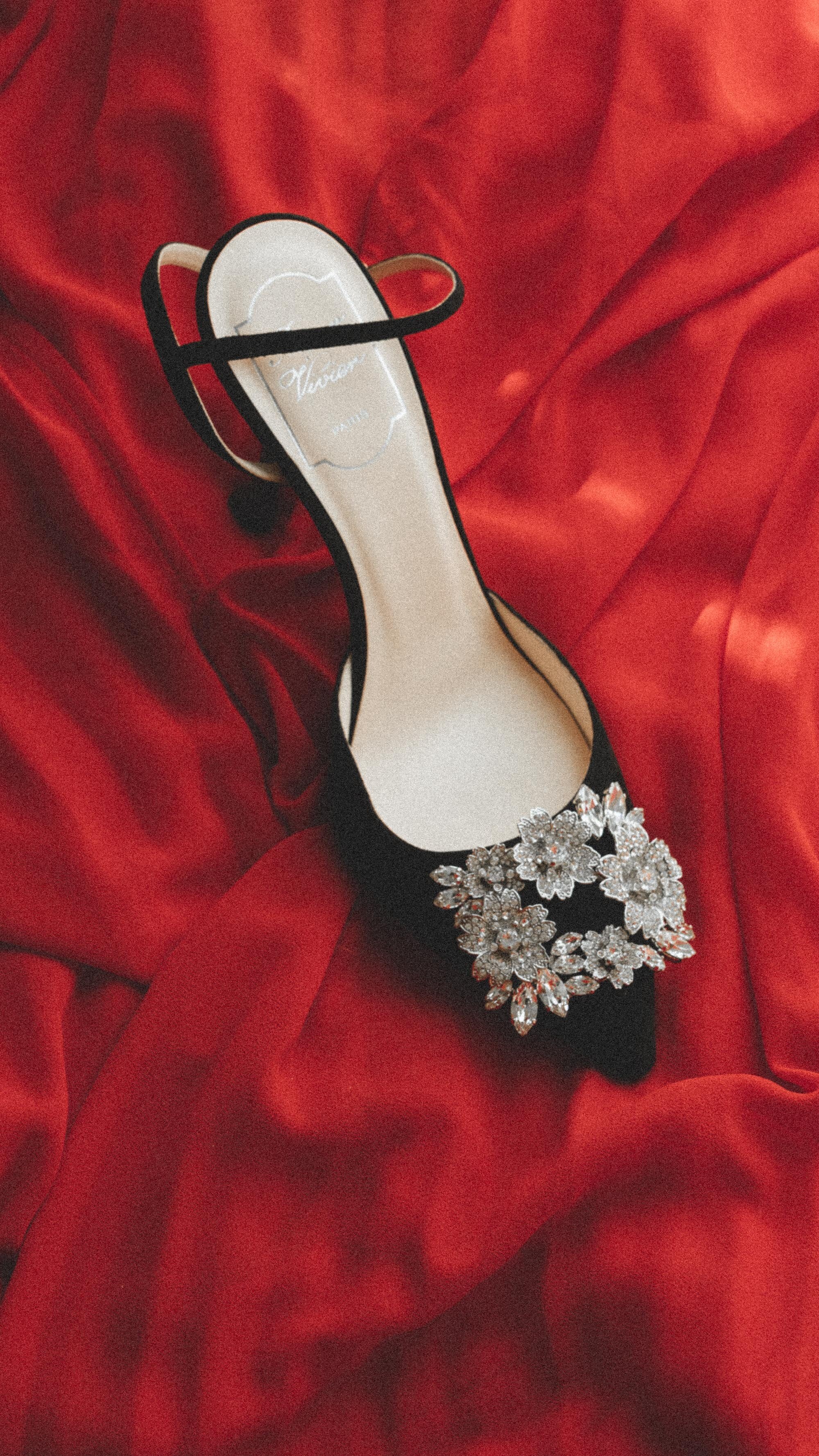 Chicest holiday heels to sparkle in. Sarah Butler of @sarahchristine wearing Roger Vivier Sling Back RV Bouquet Strass Buckle Pumps. The heels celebrate sophisticated and precious femininity --8.jpg