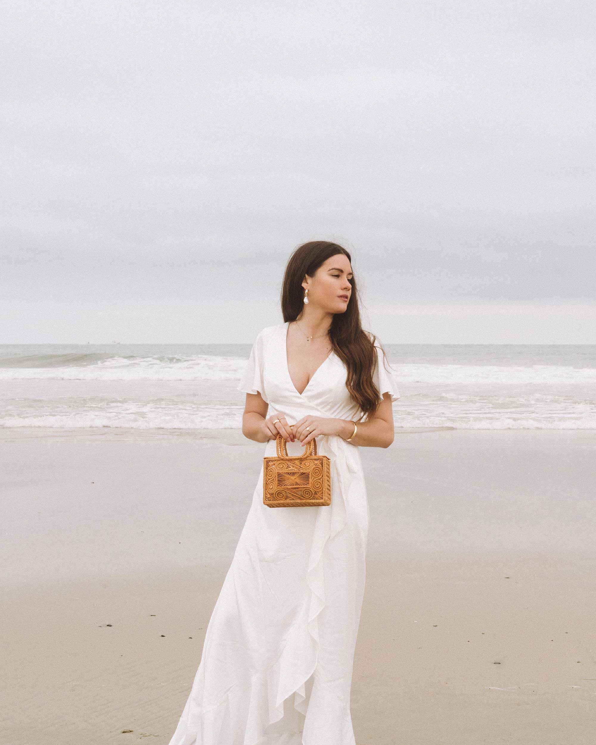 Chic white dresses for spring. Sarah Butler of @sarahchristine wearing  Charmeuse Ruffle Mini Dress with Back Tie and Flutter Sleeve Stretch Satin Dress with Ruffle Hem in Newport Beach, California -7.jpg