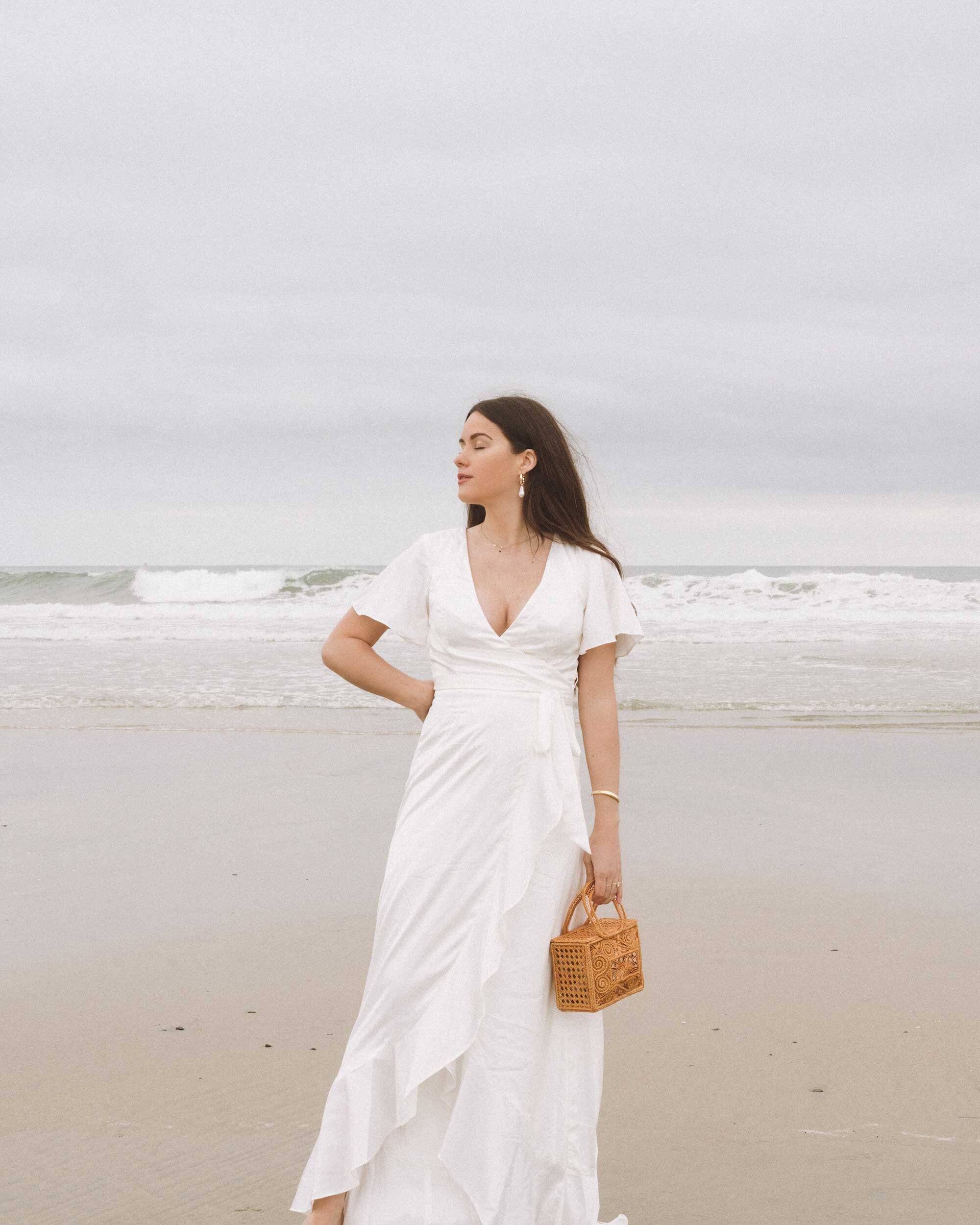 Chic white dresses for spring. Sarah Butler of @sarahchristine wearing  Charmeuse Ruffle Mini Dress with Back Tie and Flutter Sleeve Stretch Satin Dress with Ruffle Hem in Newport Beach, California -8.jpg