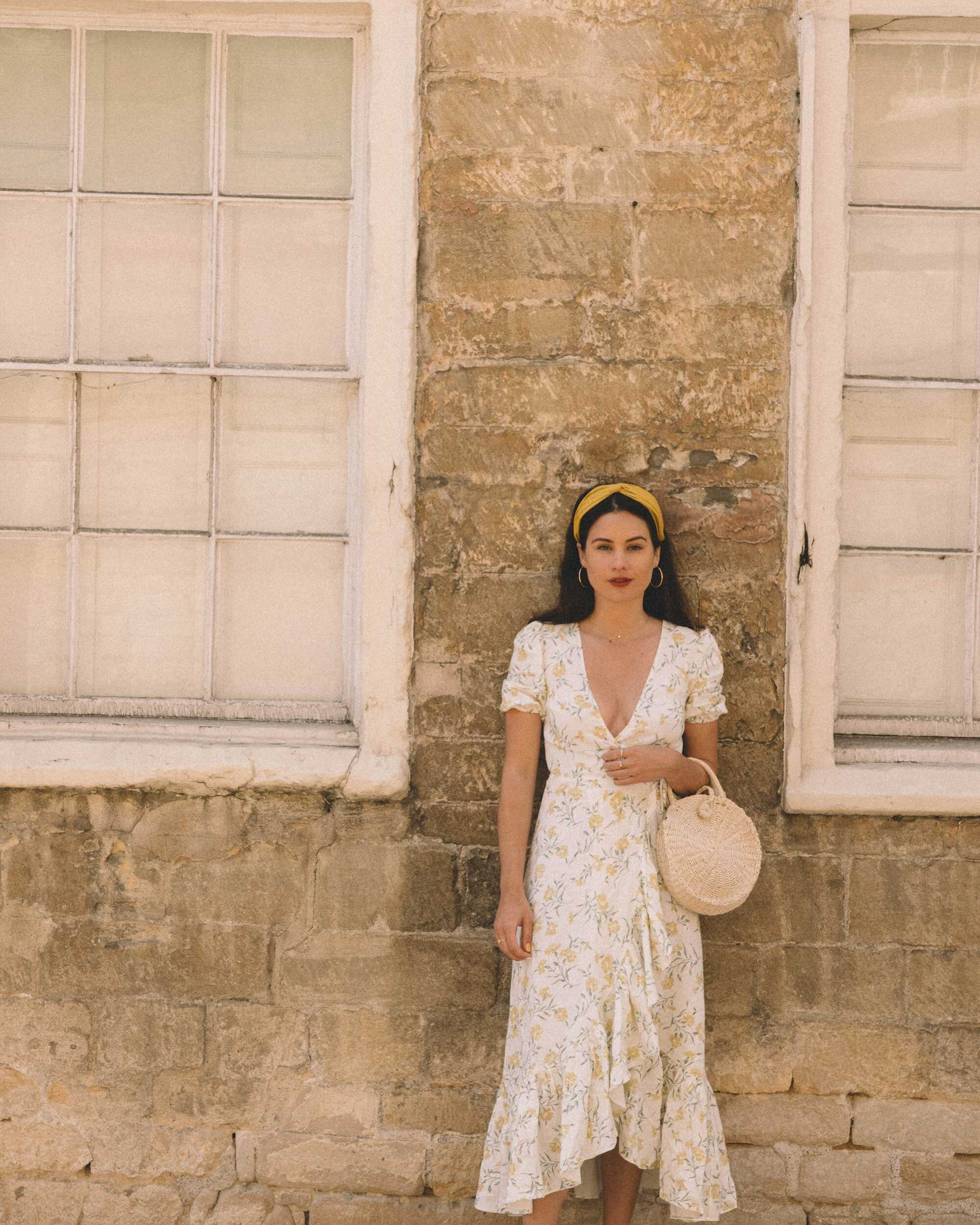 Sarah+Butler+of+Sarah+Styles+Seattle+wears+And+Other+Stories+Ruffled+Linen+Wrap+Midi+Dress+and+round+woven+bag+in+England+Countryside+for+the+perfect+floral+summer+dress+|+@sarahchristine+7-3.jpg