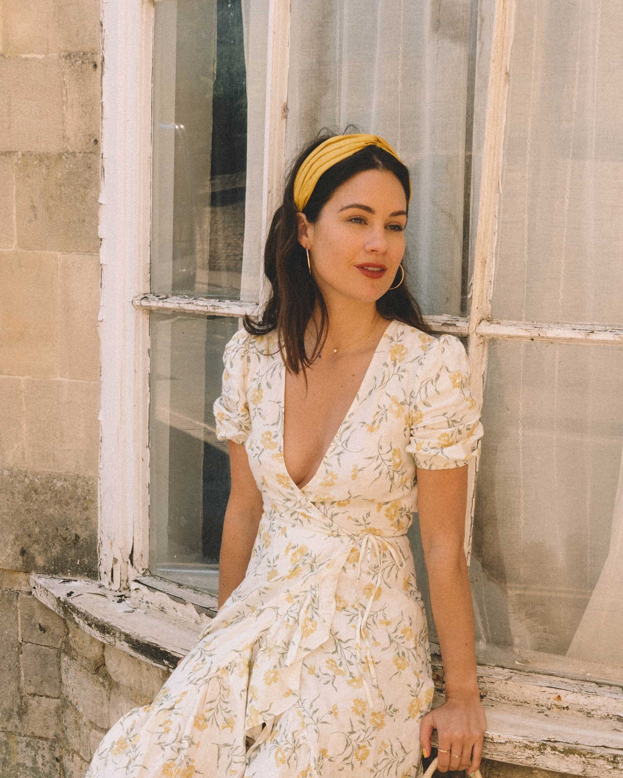 Sarah+Butler+of+Sarah+Styles+Seattle+wears+And+Other+Stories+Ruffled+Linen+Wrap+Midi+Dress+and+round+woven+bag+in+England+Countryside+for+the+perfect+floral+summer+dress+|+@sarahchristine+13-3.jpg