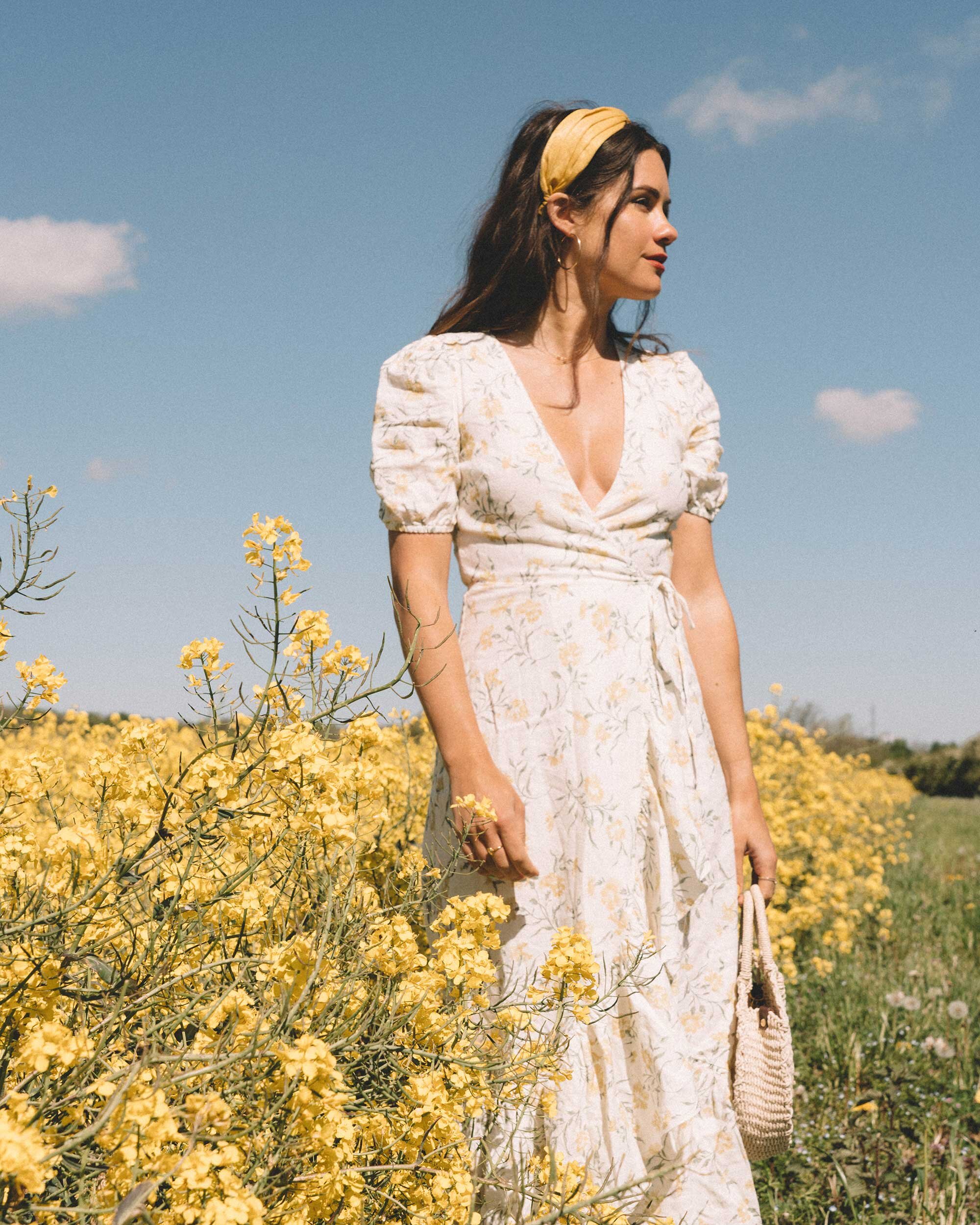 Sarah+Butler+of+Sarah+Styles+Seattle+wears+And+Other+Stories+Ruffled+Linen+Wrap+Midi+Dress+and+round+woven+bag+in+England+Countryside+for+the+perfect+floral+summer+dress+|+@sarahchristine+6.jpg