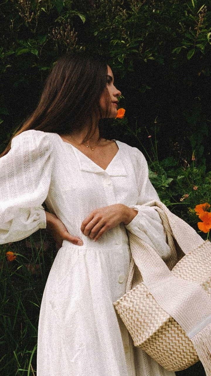 Dresses for Every Summer Occasion. Sarah Butler of @sarahchristine wearing effortless white summer dress with billowy sleeves featuring JW ANDERSON Basket leather-trimmed woven raffia tote in Seattle, Washington2.jpg