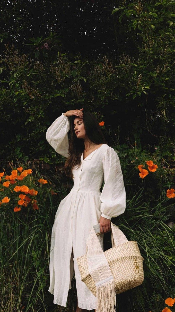 Dresses for Every Summer Occasion. Sarah Butler of @sarahchristine wearing effortless white summer dress with billowy sleeves featuring JW ANDERSON Basket leather-trimmed woven raffia tote in Seattle, Washington4.jpg