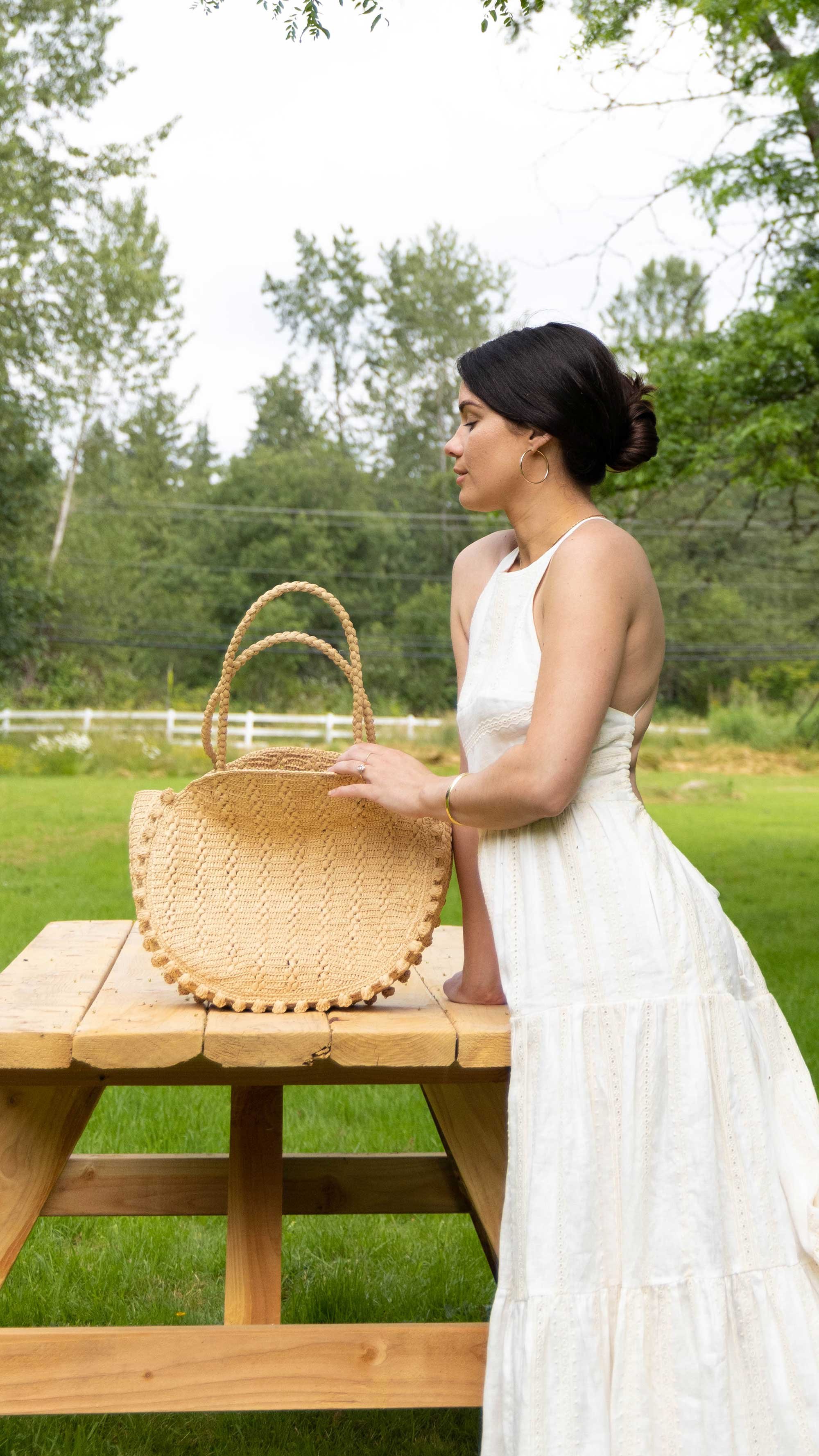 Feminine summer outfit idea: IVORY LINEN BACKLESS HALTER MIDI DRESS. Sarah Butler of @sarahchristine wearing Shona Joy halter tiered midi dress with back cut out detail in a linen broderie englaise in Seattle, Washington.2.jpg