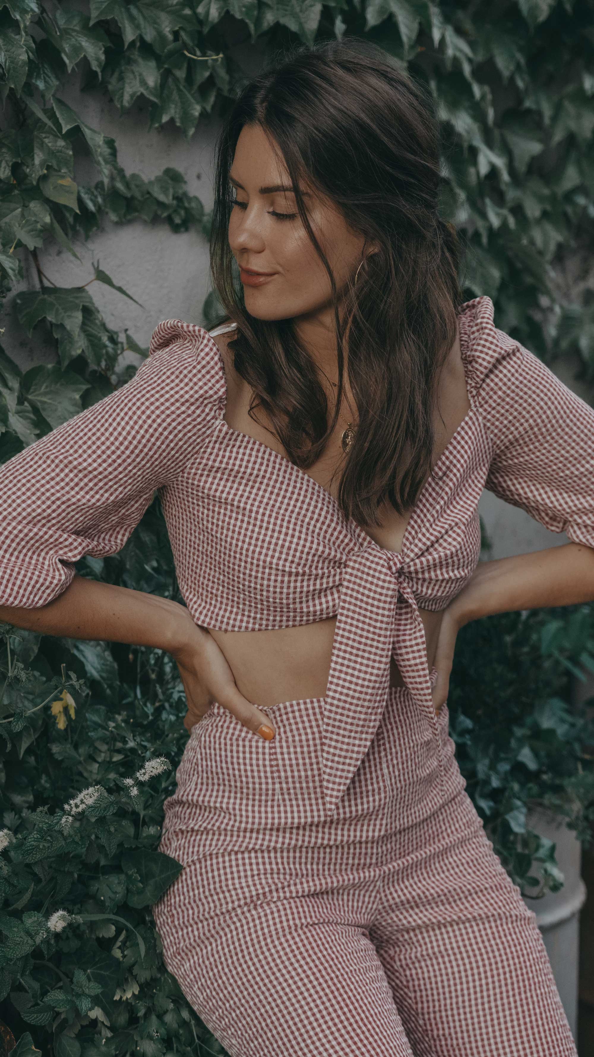 Gingham Summer Outfit. Sarah Butler of @sarahchristine wearing gingham crop top and pants coordinating set for a chic summer look -1.jpg