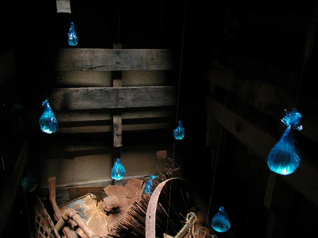  inside: a layer of metal with drops of blue water raining down. 