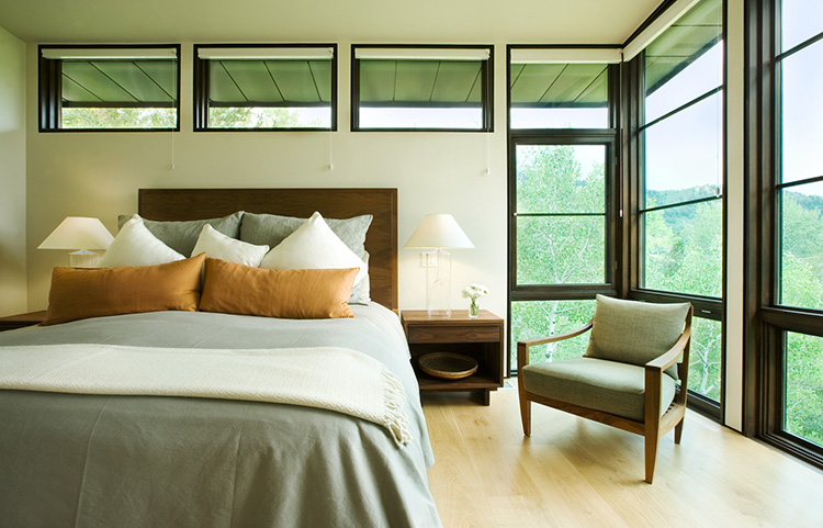  This inviting and serene master bedroom with floor to ceiling windows is like sleeping in the trees. 