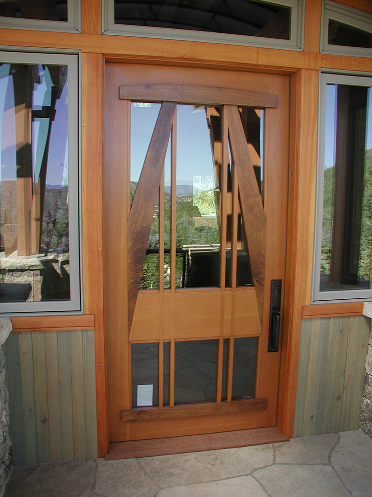  Custom Entry door with unique wood trim 