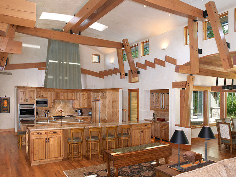  Huge kitchen with soaring ceilings, exposed beams with a traditional mountain home feel. 