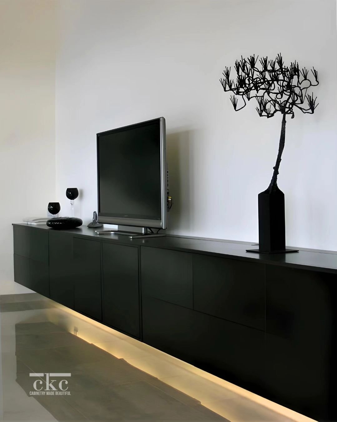 Craving a modern living room refresh? 

This floating TV stand is the answer! Its clean lines and black finish create a sleek aesthetic, while the space-saving design opens up your living room. Perfect for small or cozy spaces, this stand is the miss
