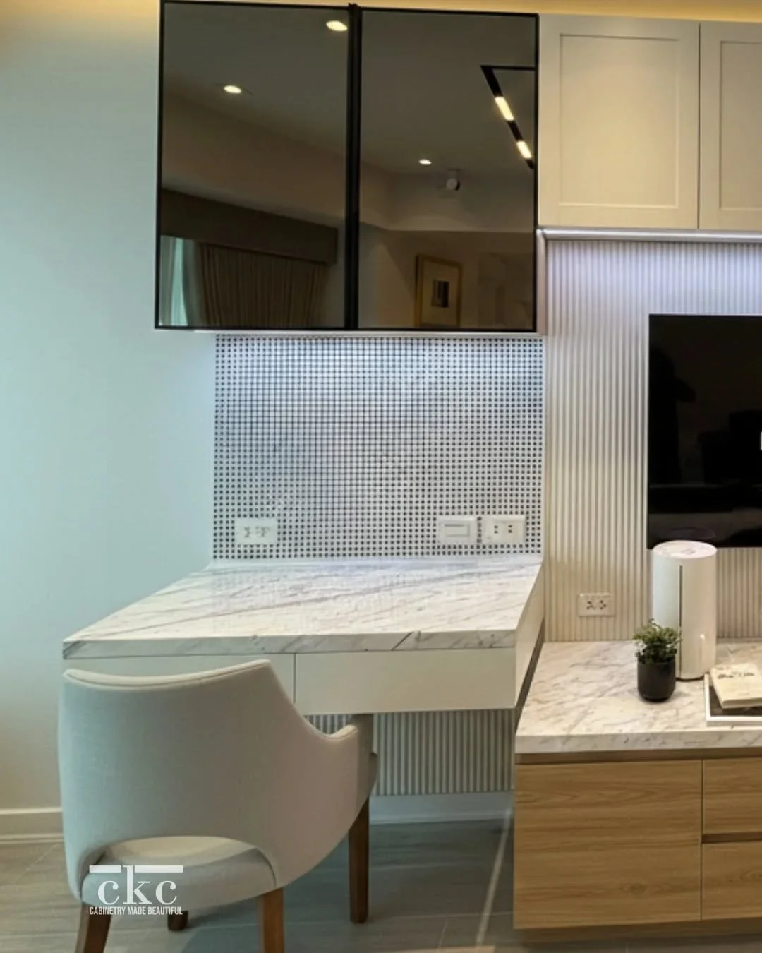 A place for everything, and everything in its place. 🤎 We love the cohesive look in this room, flowing seamlessly from the bedroom closet right over to the custom media console with integrated lighting and a matching vanity unit. Another custom bedr