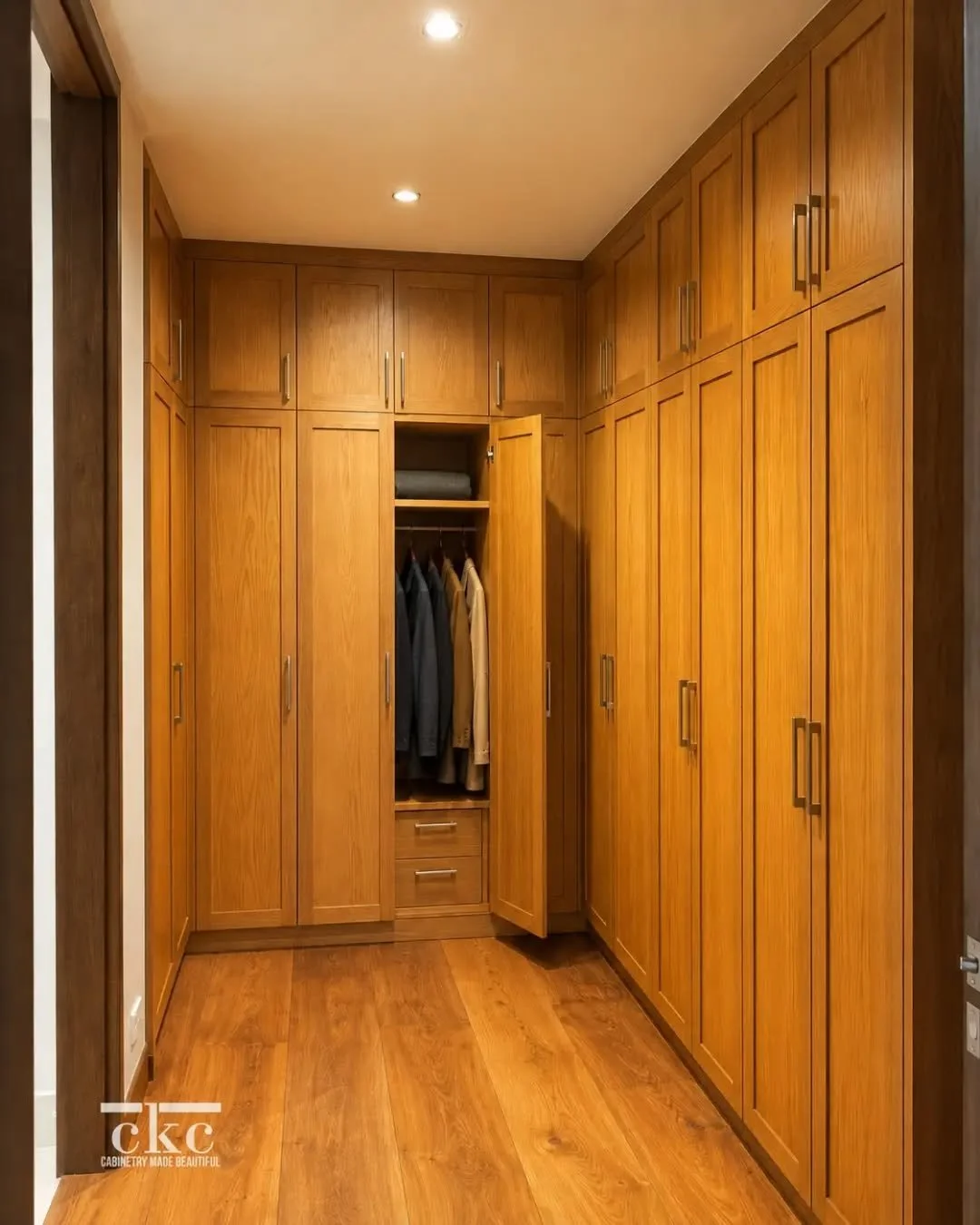When storage becomes part of the architecture.✨ 

This walk in wardrobe was designed with full height cabinetry, warm wood finishes, and tailored internal organization, bringing clarity, proportion, and material warmth into a highly functional space.