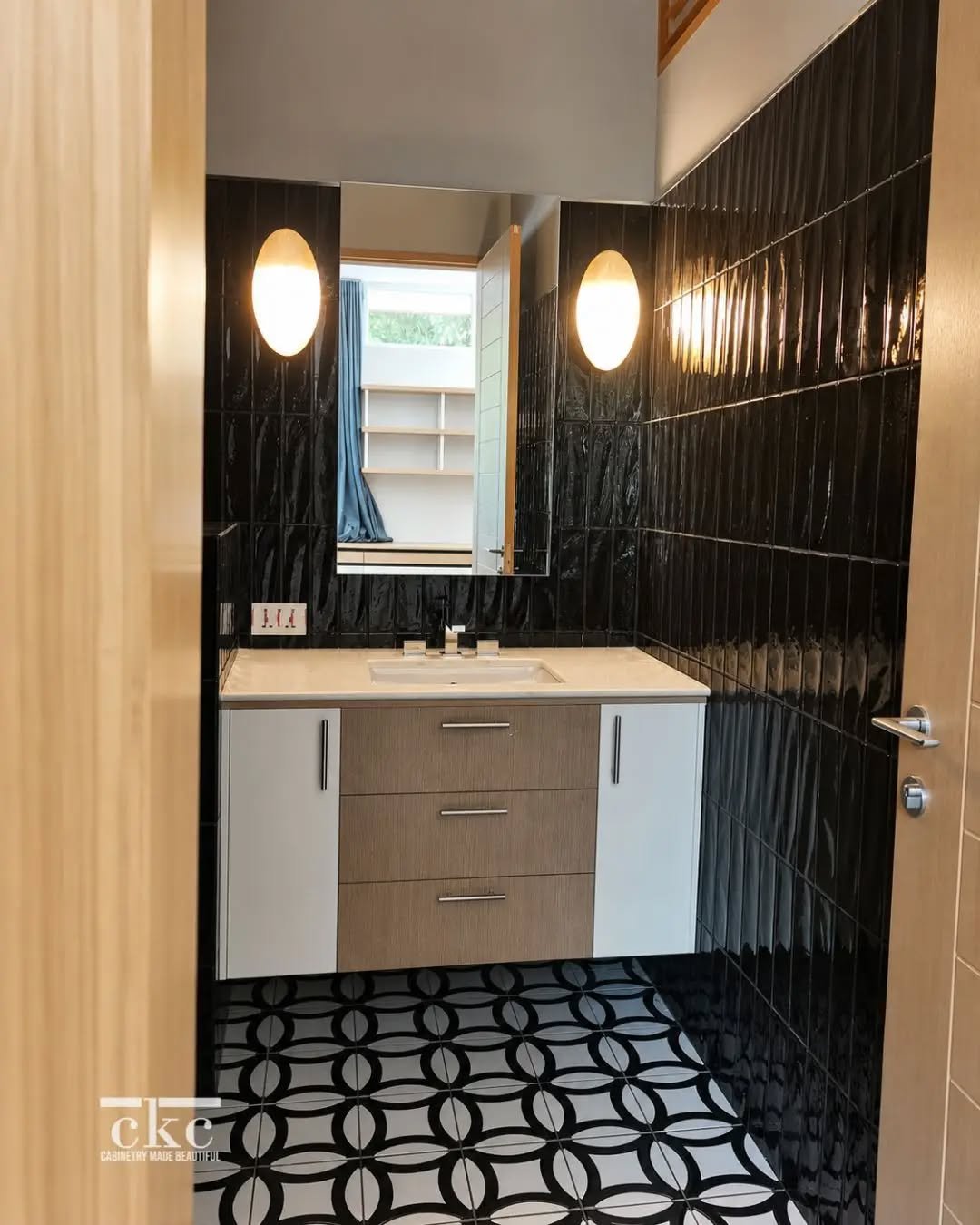 ✨️ Sometimes, it&rsquo;s the smallest spaces that invite the most considered design.

A custom bathroom vanity brings together warm wood tones, clean-lined storage and a tailored fit&mdash;set against dramatic black tile and graphic flooring for a sp