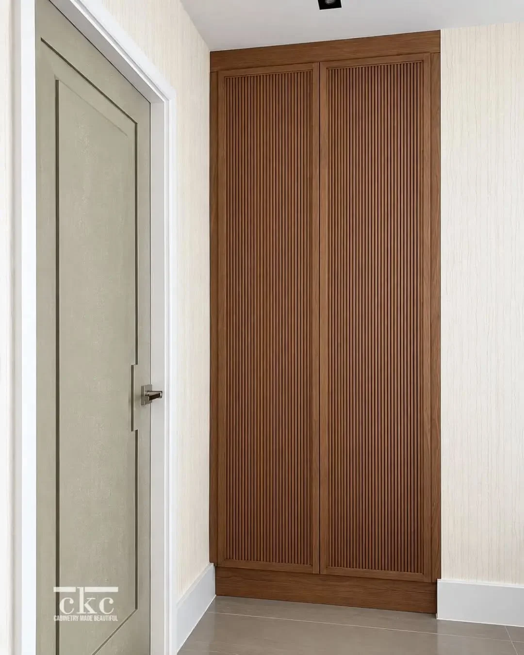 You&rsquo;d be surprised how custom cabinetry can transform even the most overlooked corners of your home.

What could have been an unused wall becomes a beautiful, functional feature. Here, warm wood tones and fluted cabinet doors conceal generous s