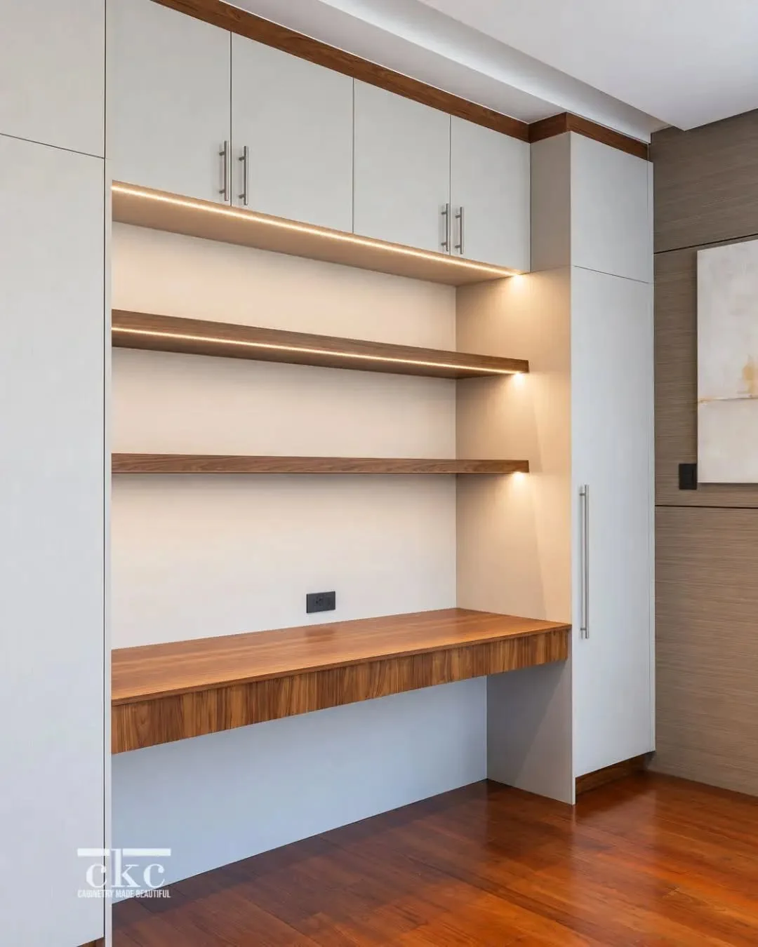 Make the most of every wall with thoughtfully designed custom cabinetry.

By bringing together full-height storage, open shelving, and a dedicated workspace, this wall-to-wall composition transforms an otherwise ordinary wall into a functional yet re