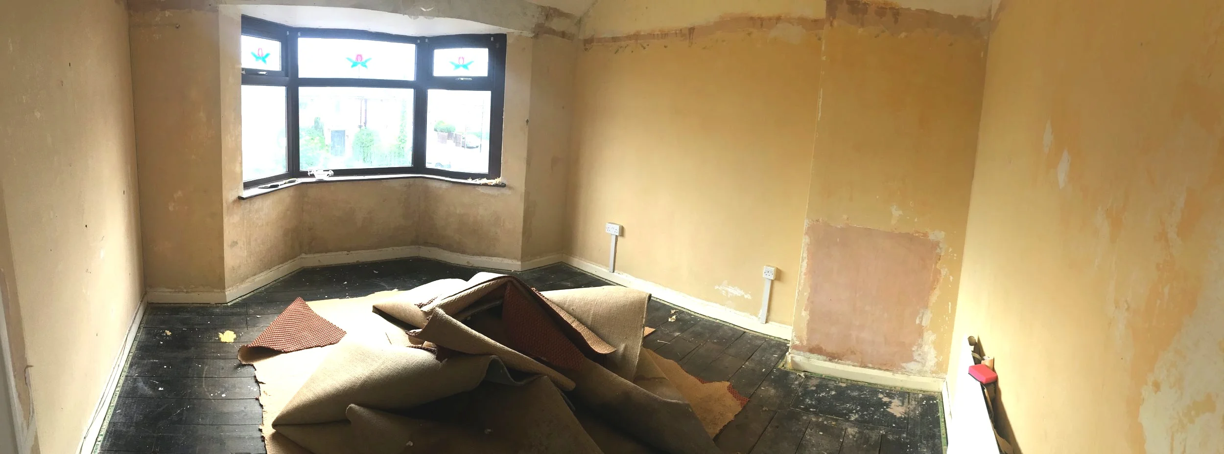 One of the bedrooms: stripped down (easily removable wallpaper) and ready to go