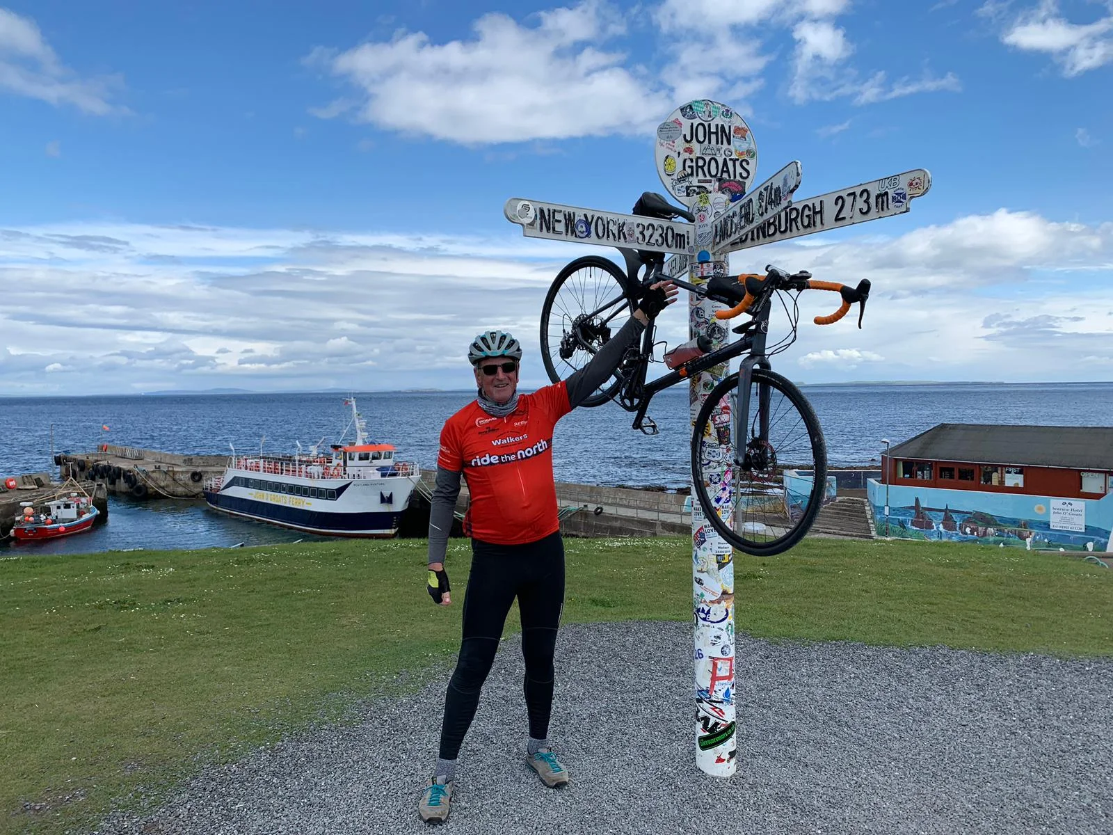 John Morton celebrates reaching John O’Groats during the North Coast 500