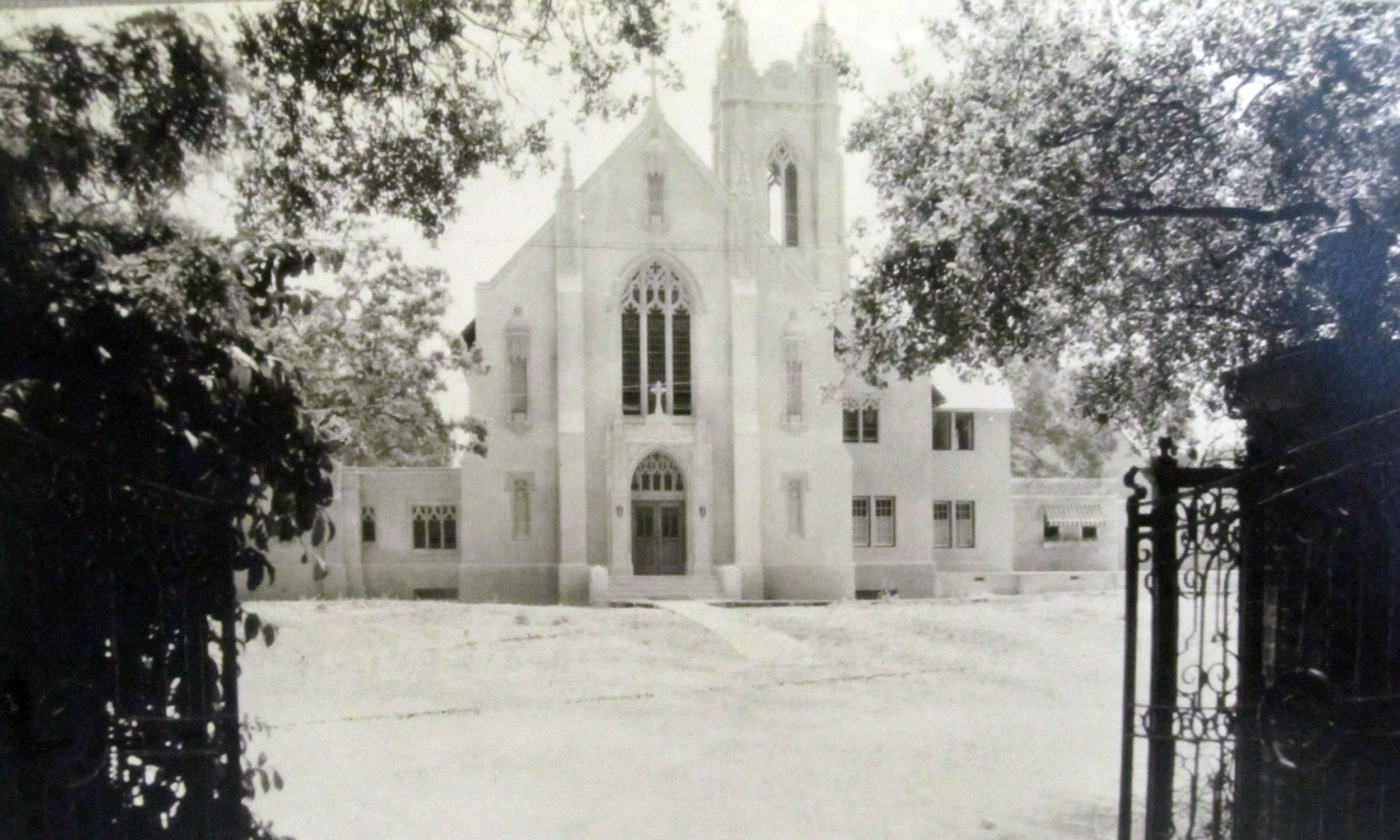 Picture taken from the drive to Vallombrosa Retreat Center ("across the street") of the first phase of our monastery - the chapel wing. Note to the right of the chapel where we now have the north wing with the public/extern areas and parlors, it's still trees!