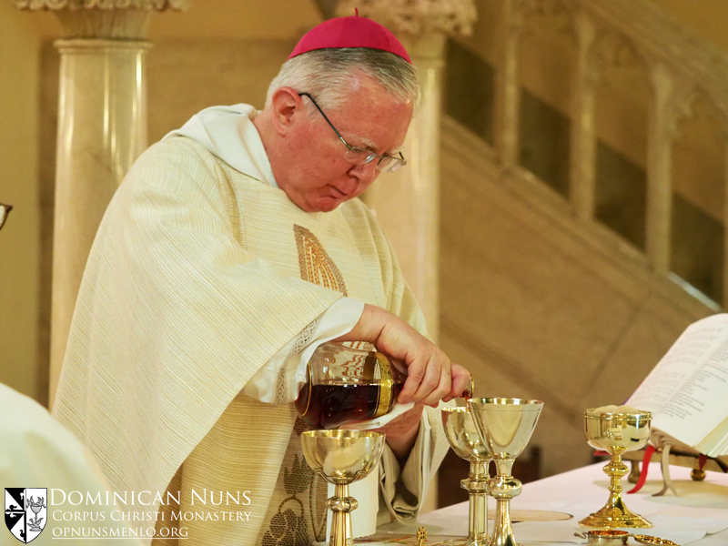 Bishop Robert Christian, O.P. preparing the gifts.