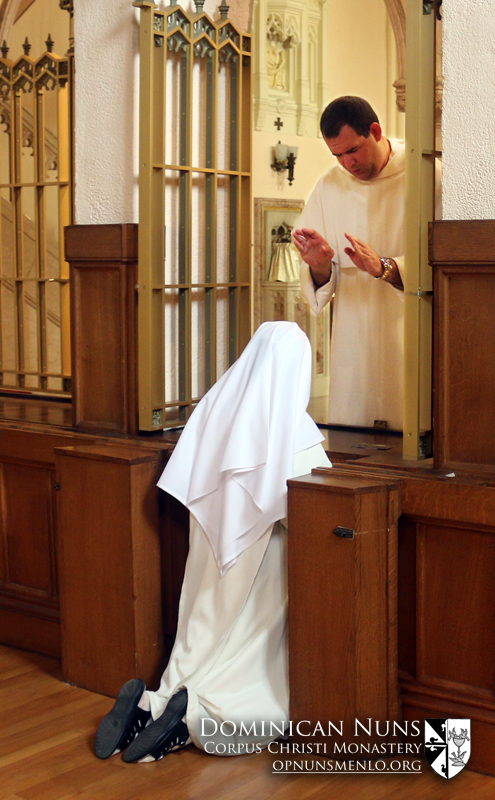 Father Henry Stephan, O.P. of the Eastern Dominican Province gives his blessing to the sisters after his Mass of Thanksgiving.