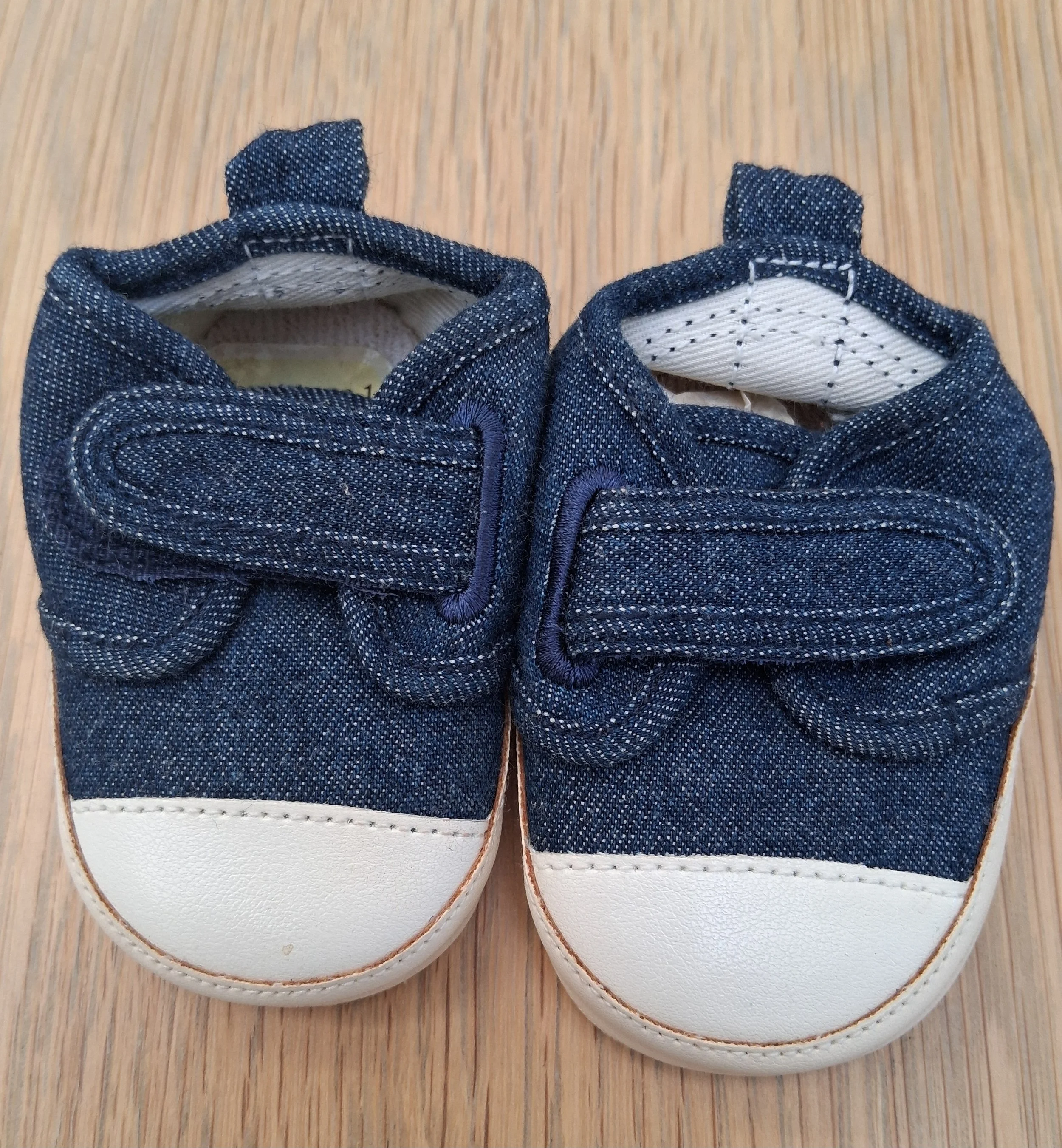 A tiny pair of trainers - unworn