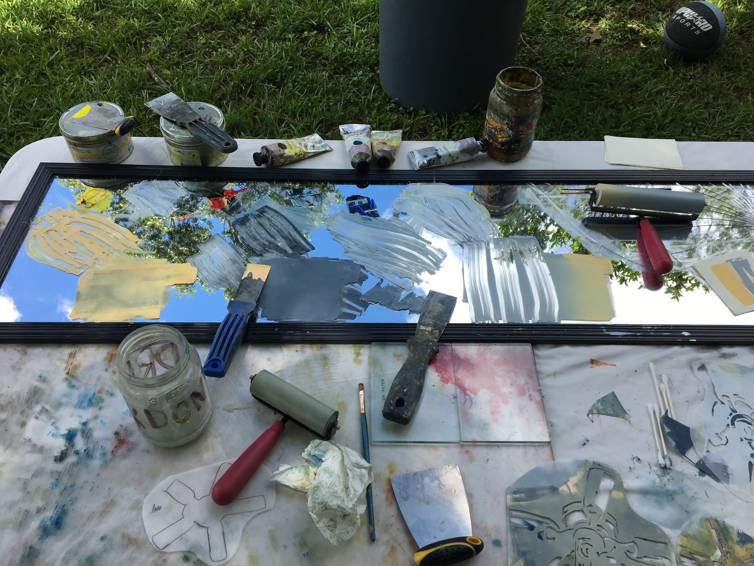  After loosing access to a printing press, I ventured to figure out how to print without a real press during the summer of 2018. My “studio” was a plastic fold out table I covered with a sheet, a large piece of plexi, a broken mirror for ink, and my 