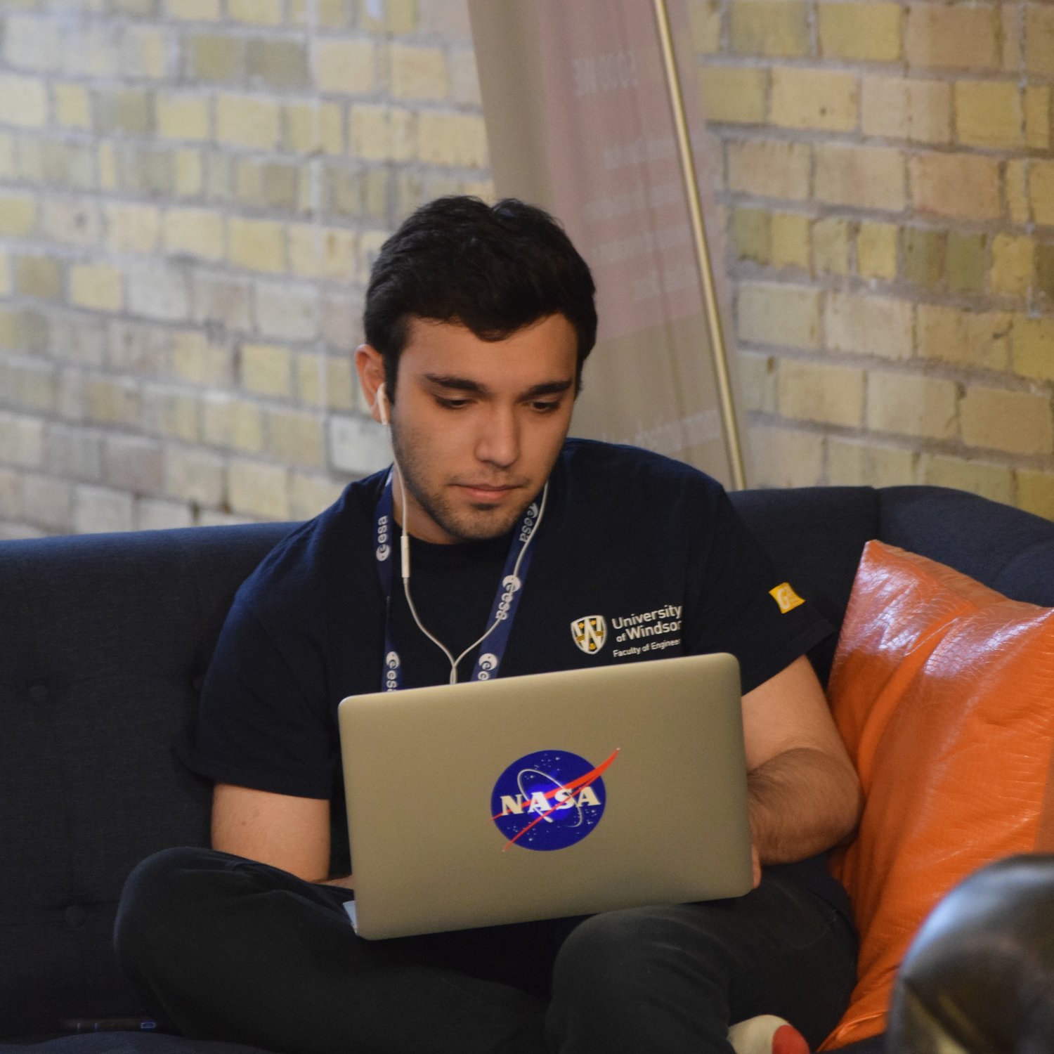 2017 NASA Space Apps participant typing on his computer in the Kitchener Communitech space.