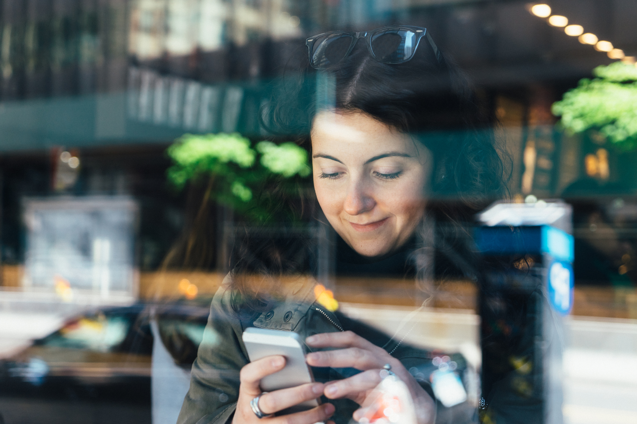 Woman on phone in cafe.jpg