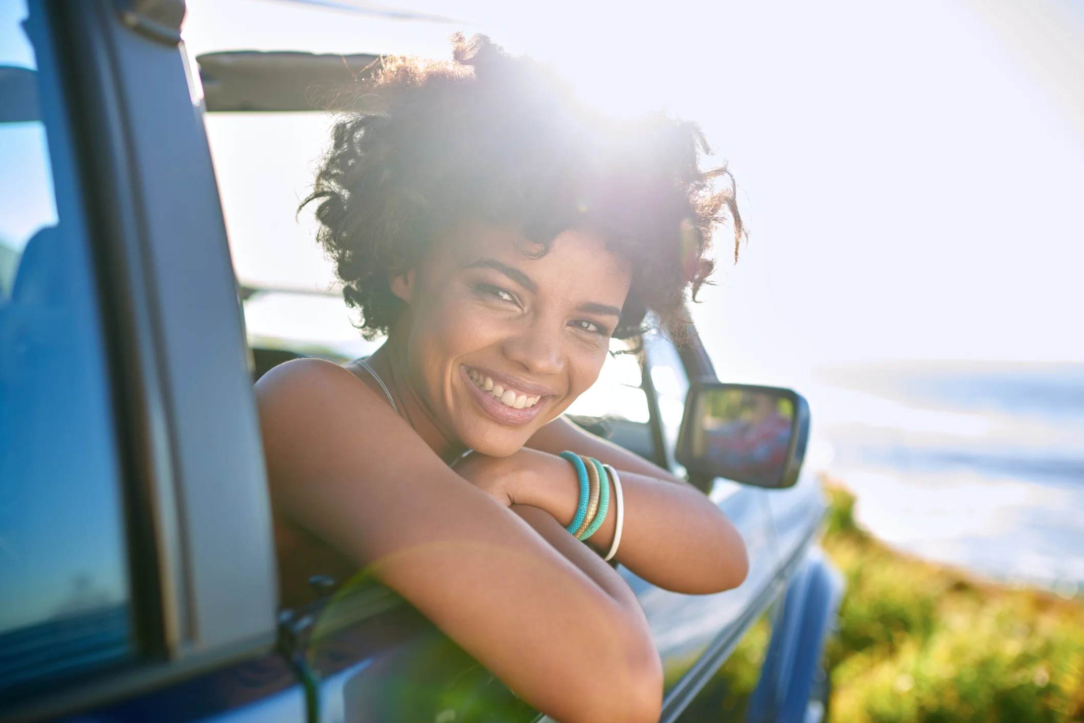 Woman leaning out of car window.jpg