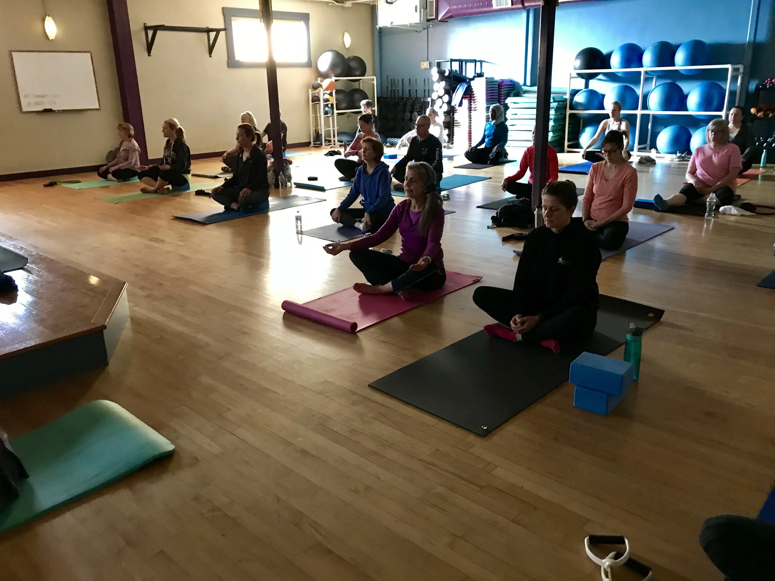 Finding a comfortable seat for each student's body to breathe in this moment and breathe out the rest of the day at the start of one of Daniella's slow flow classes. 