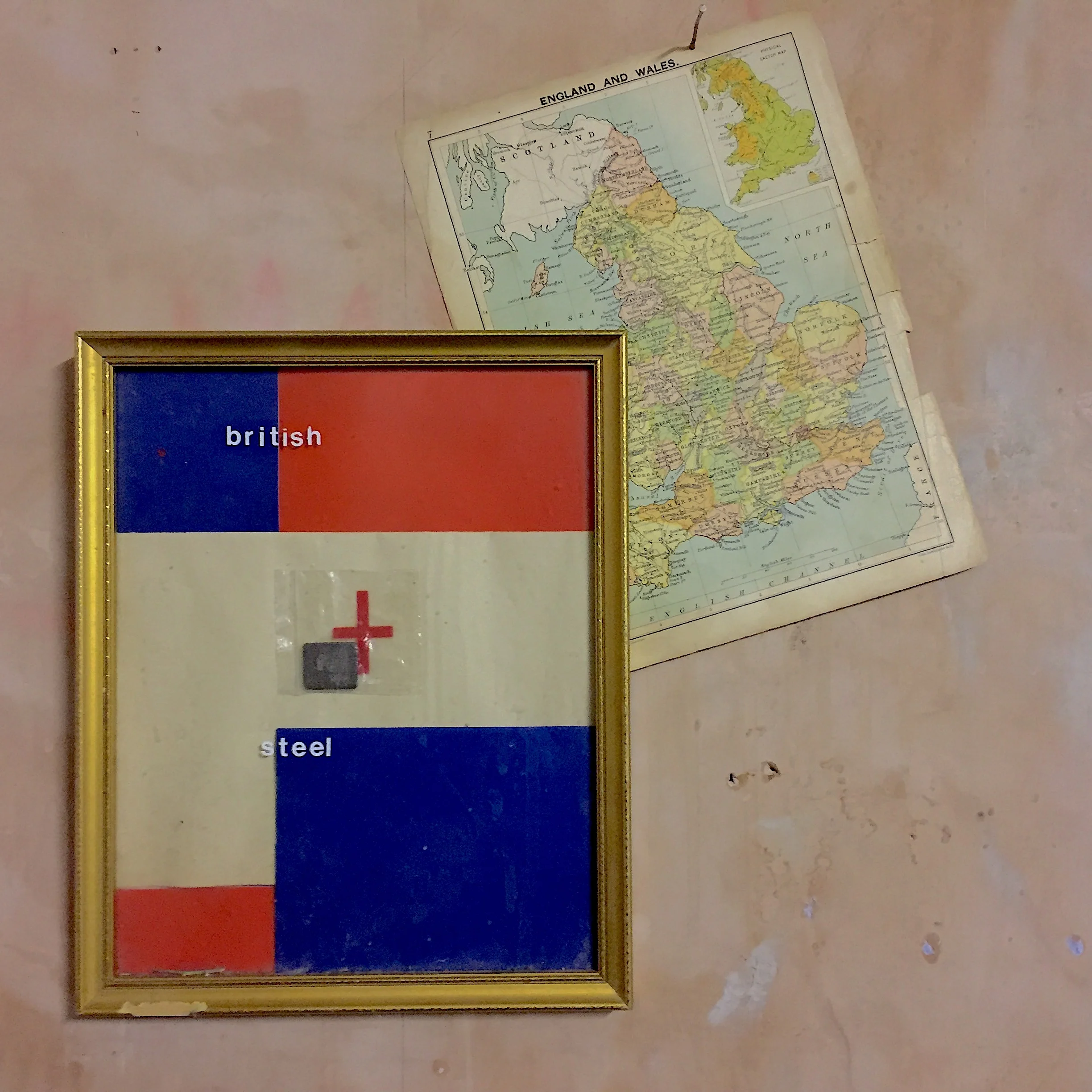 British Steel (Assembled 2010) Soviet era coloured tissue paper, found drugs bag with cross of St George, found iron ingot enclosed in drugs bag, letraset, dust, hairspray, old family photo frame