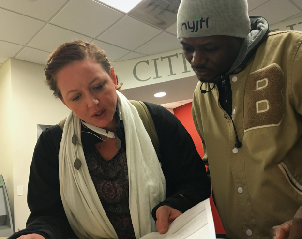 A Freedom for Immigrants volunteer accompanies a recently released immigrant to a government meeting.