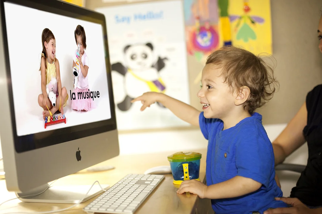 Boy pointing to screen.jpeg