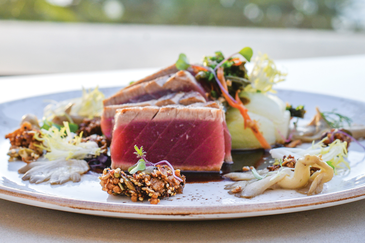 One of the items on the pupu menu is the blackened ahi, garnished with fresh pohole ferns grown locally on Maui. Photo: Heather Ellison