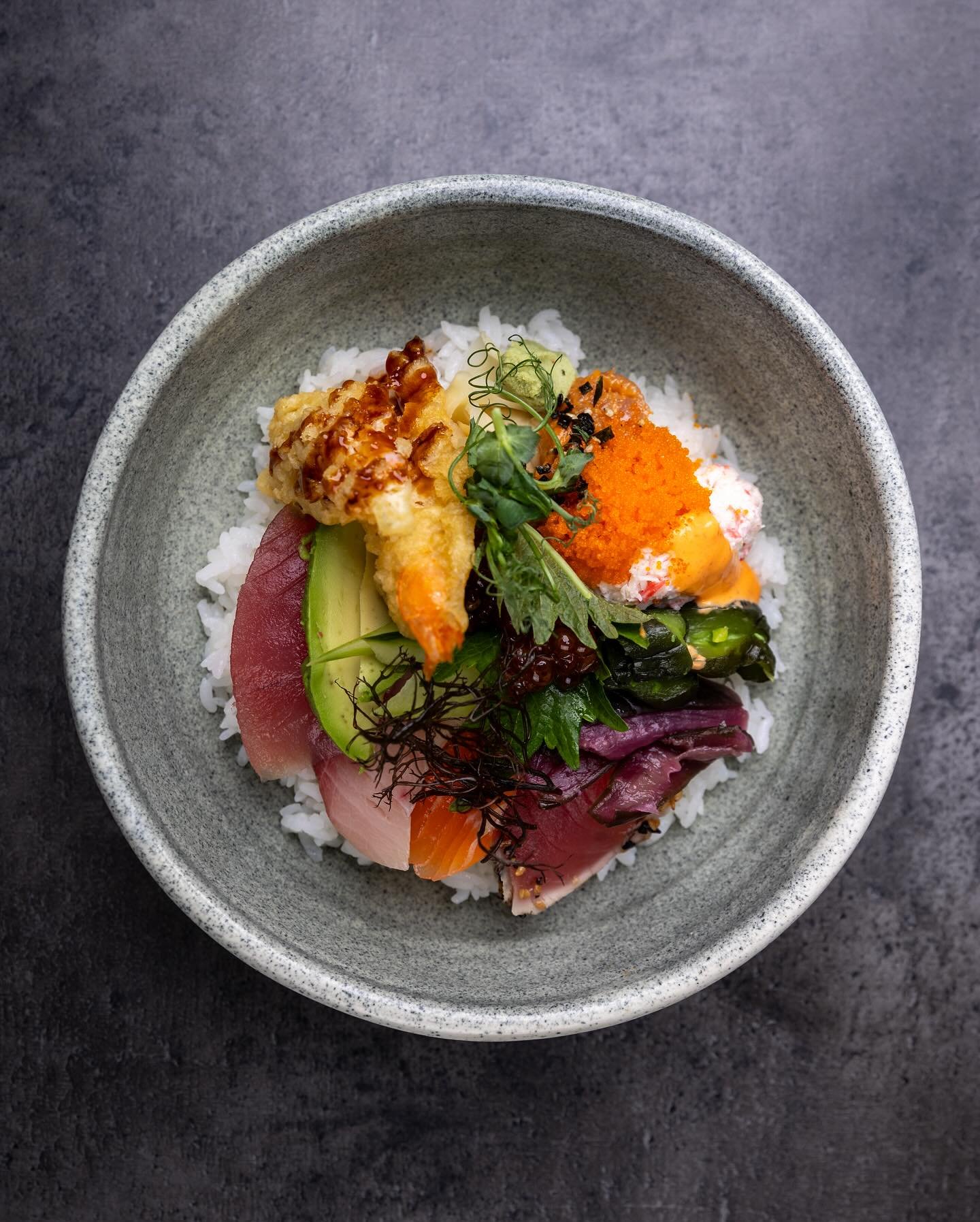 Our Chirashi Bowl layers Tuna, Salmon, Hamachi, and Ahi Tataki with Shrimp Tempura, Ikura, Avocado, Tsukemono, Tobiko, Crab Mix, Spicy Tuna, and Cucumber, all served atop a bed of sushi rice, this bowl is a feast for the senses.