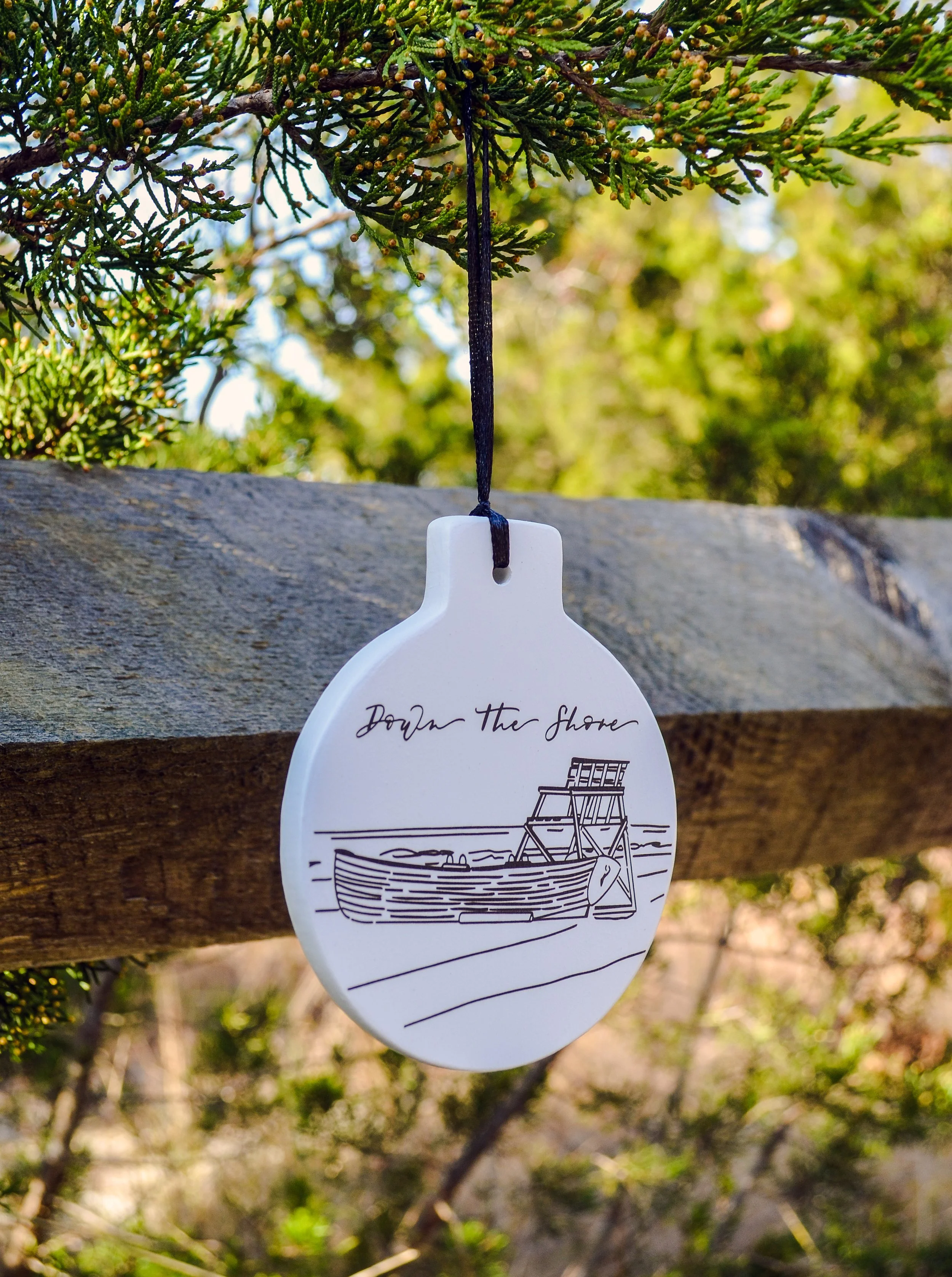 Girl Holding a Pen Down the Shore Ornament