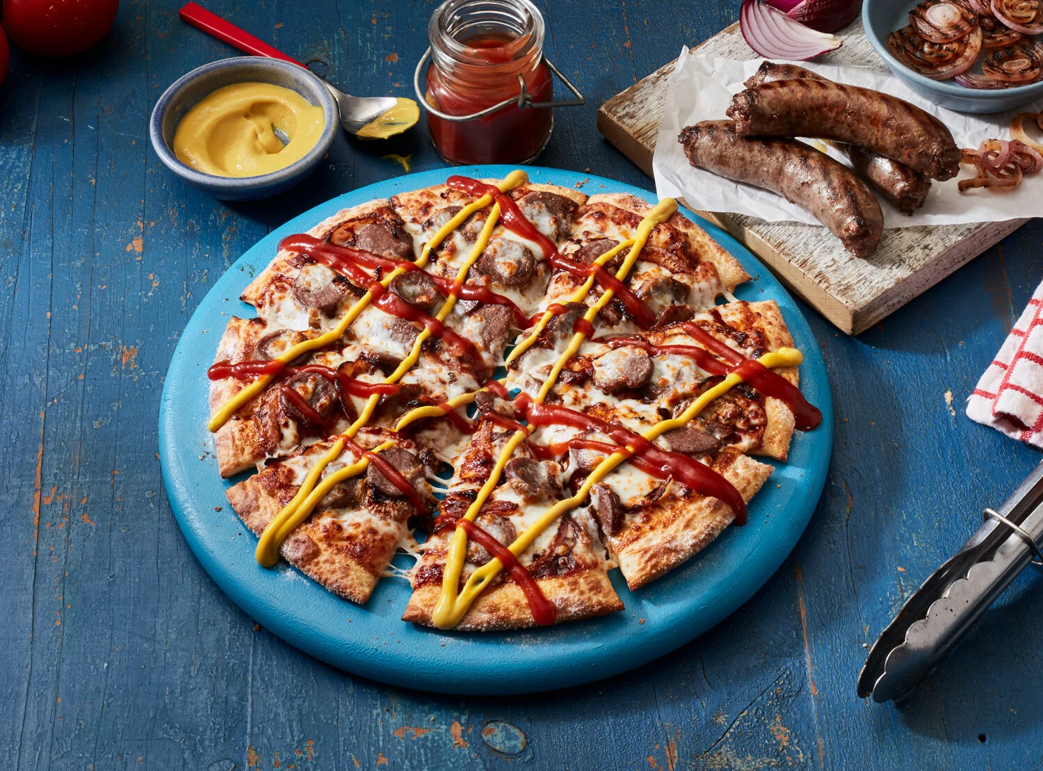 Make summer an absolute banger with Domino’s new Sausage Sizzle Pizza