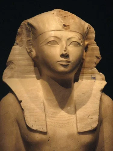 Note the pharaonic headdress and naked torso, both typically masculine symbols.