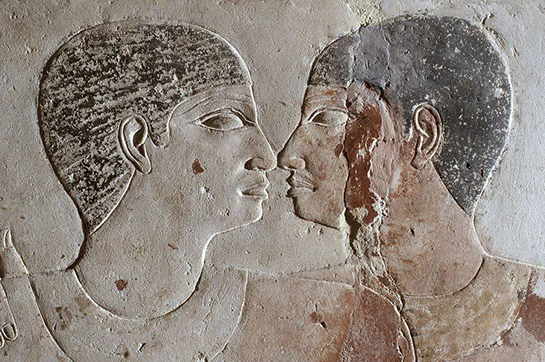Close up of Niankhkhnum and Khnumhotep nose kissing, one of the most intimate positions two people could have in Egyptian iconography.